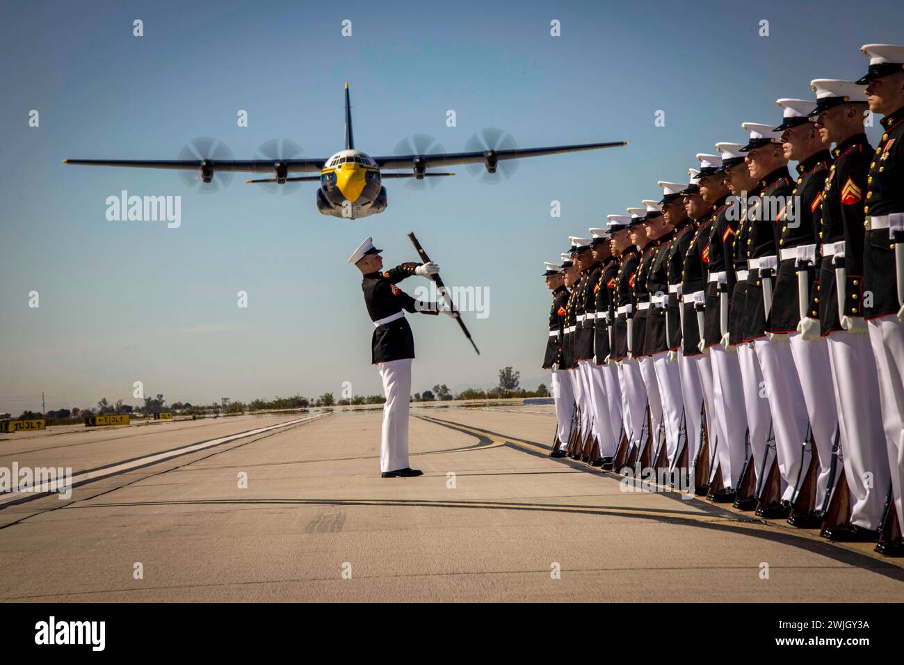 Yuma, Arizona, USA. 13th Feb, 2024. Corporal Gerald Wells III, rifle inspector, Silent Drill Platoon, conducts a rifle inspection during the Blue Angels Fat Albert C-130J Super Hercules fly-over at Marine Corps Air Station, Yuma, Ariz., February. 13, 2024. The performance was the start of this year's Battle Color Detachment Tour. (Credit Image: © U.S. Marines/ZUMA Press Wire) EDITORIAL USAGE ONLY! Not for Commercial USAGE! Stock Photo