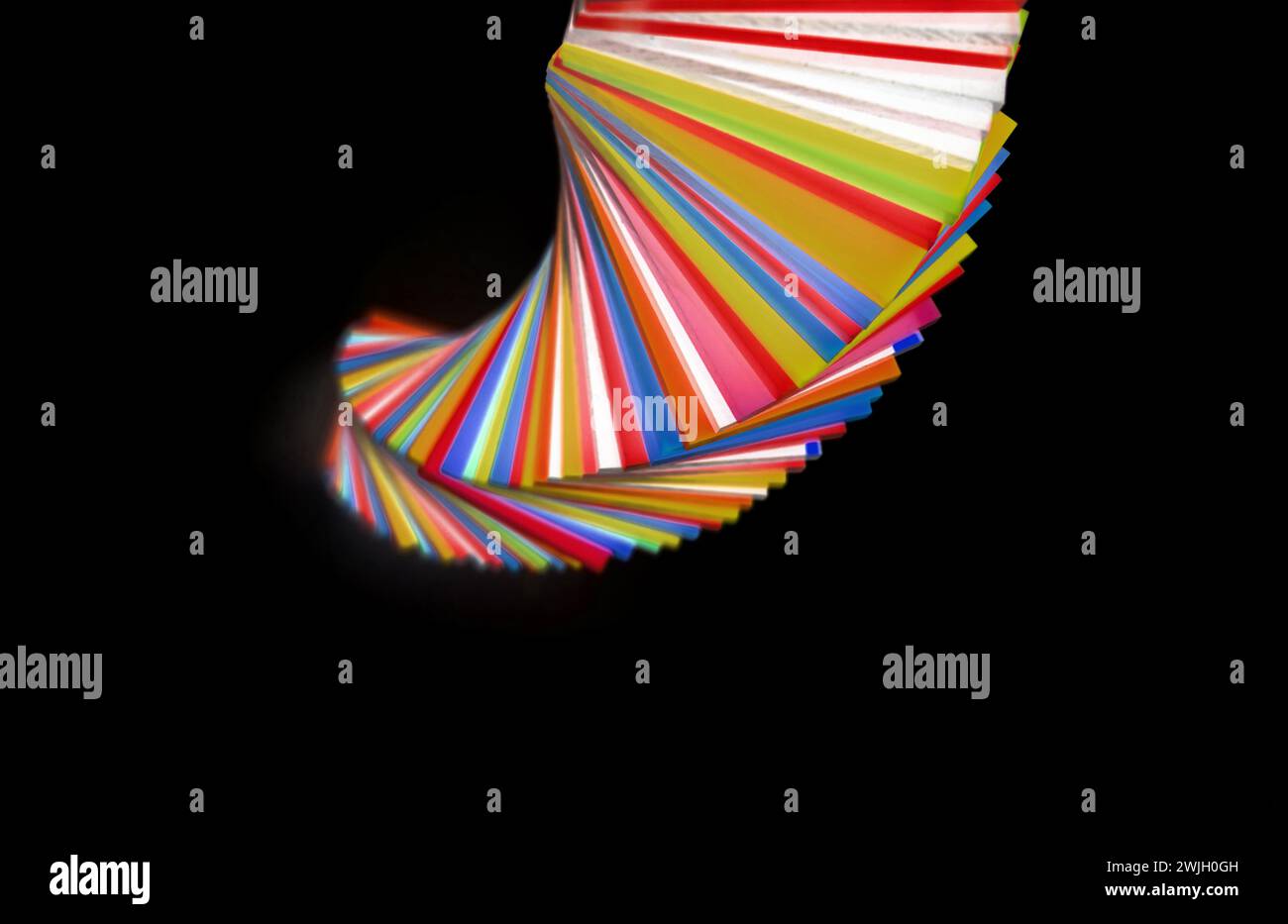 spiral Stack of different colours Cast Acrylic Sheet on dark background ...