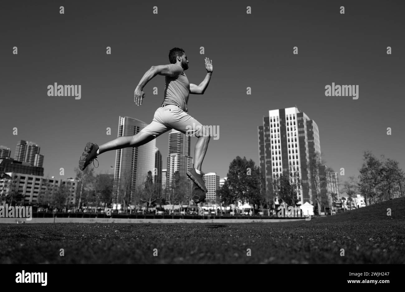 Active healthy runner jogging outdoor. Healthy lifestyle middle aged man runner running on urban citi San Diego. Stock Photo