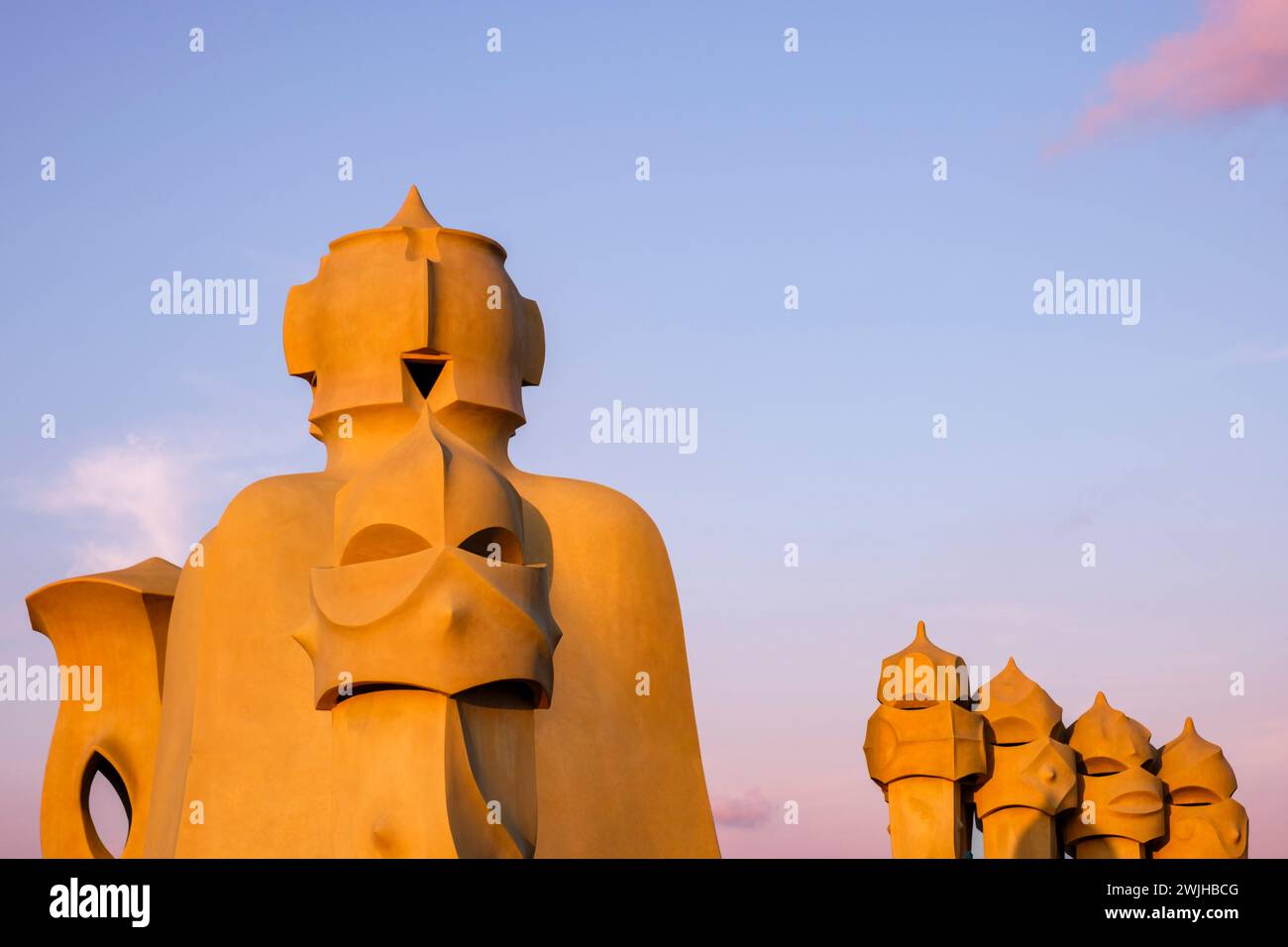 Casa Milà, La Pedrera, exterior details of rooftop chimneys and vents at sunset, modernista architecture by Antoni Gaudí, Barcelona, Spain Stock Photo