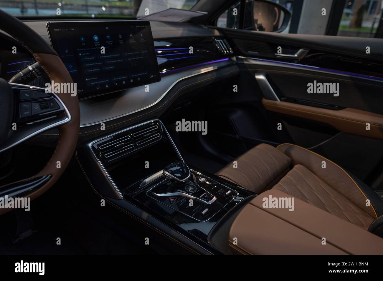 Interior, cockpit of BYD Tang Electric Car, ergonomic digital panel, instruments physical button switches, joysticks, electronic technology automotive Stock Photo