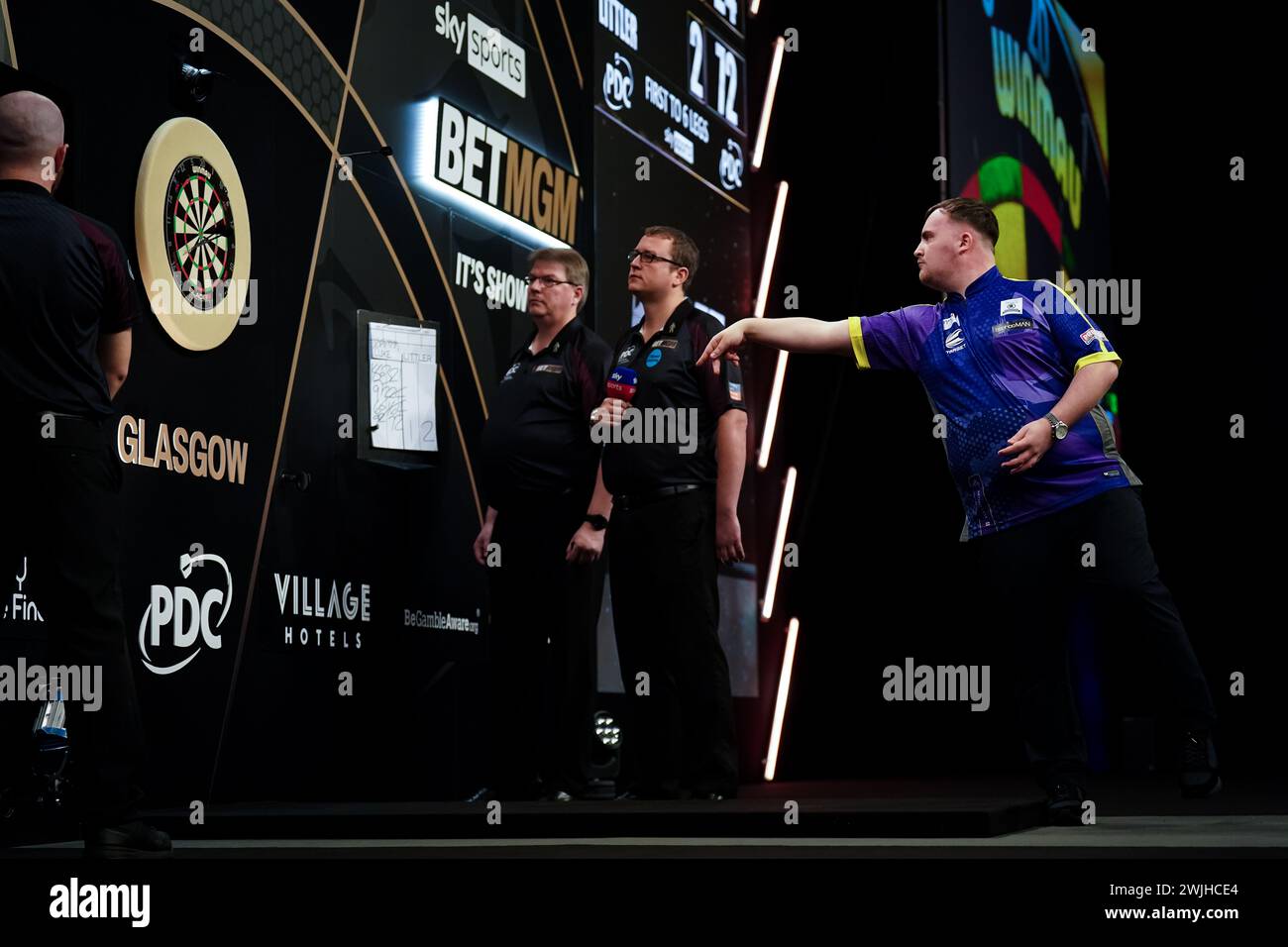 Luke Littler in action against Gerwyn Price (not pictured) during night