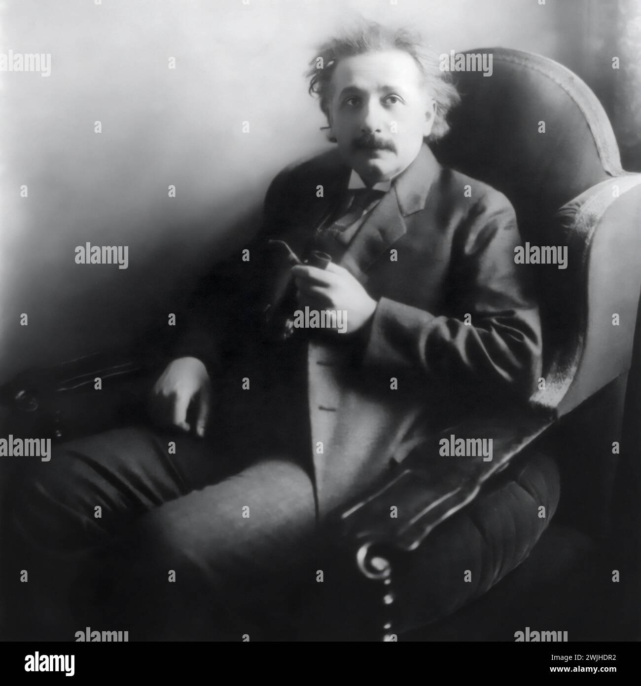Albert Einstein (1879-1955), winner of the 1921 Nobel Prize in Physics, seated with his pipe in 1921. Stock Photo