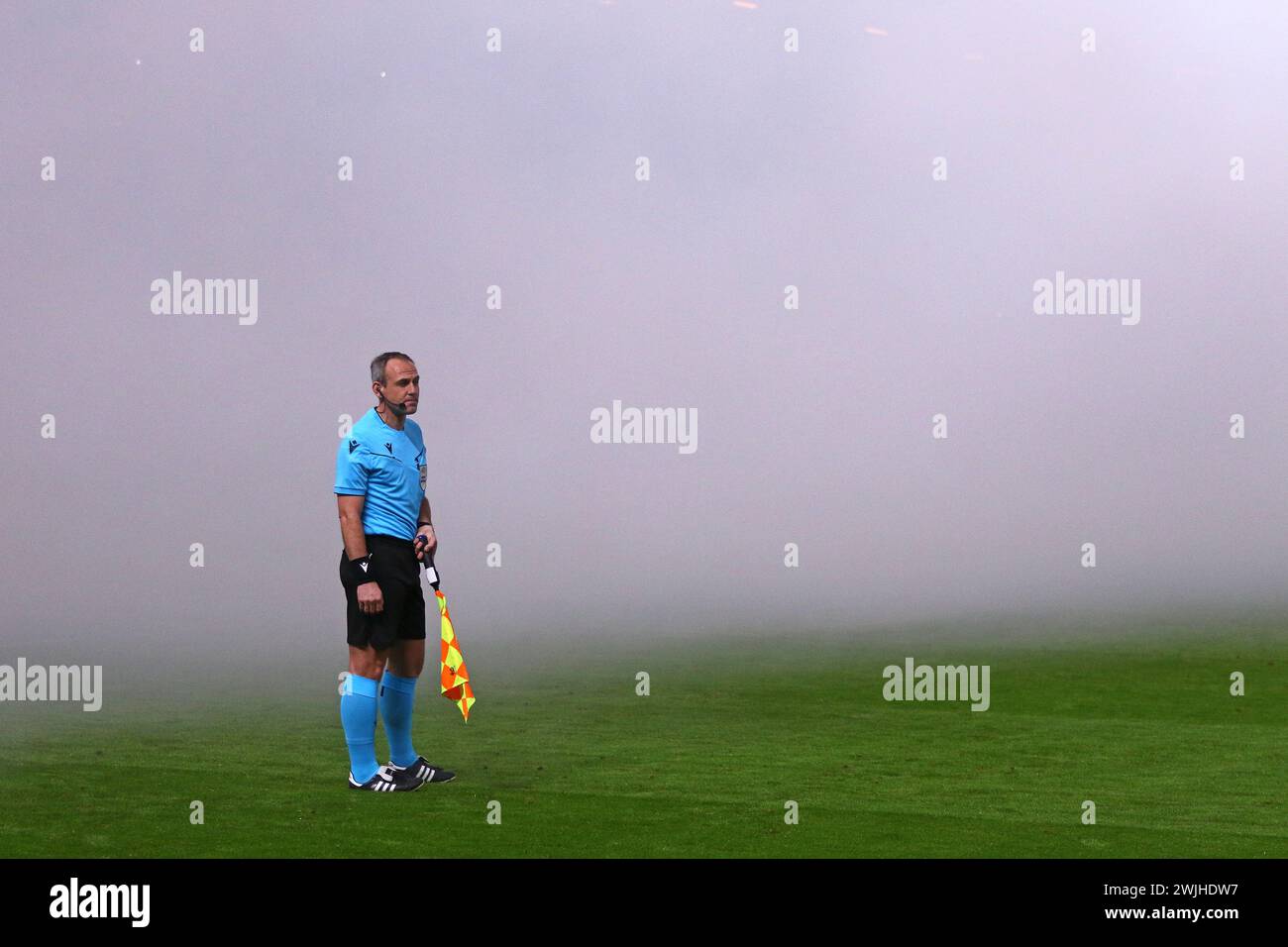 Hamburg, Germany - February 15, 2024: Smoke on the pitch of Volksparkstadion in Hamburg after ultra supporters burned flares during the UEFA Europa League game Shakhtar Donetsk v Marseille Stock Photo