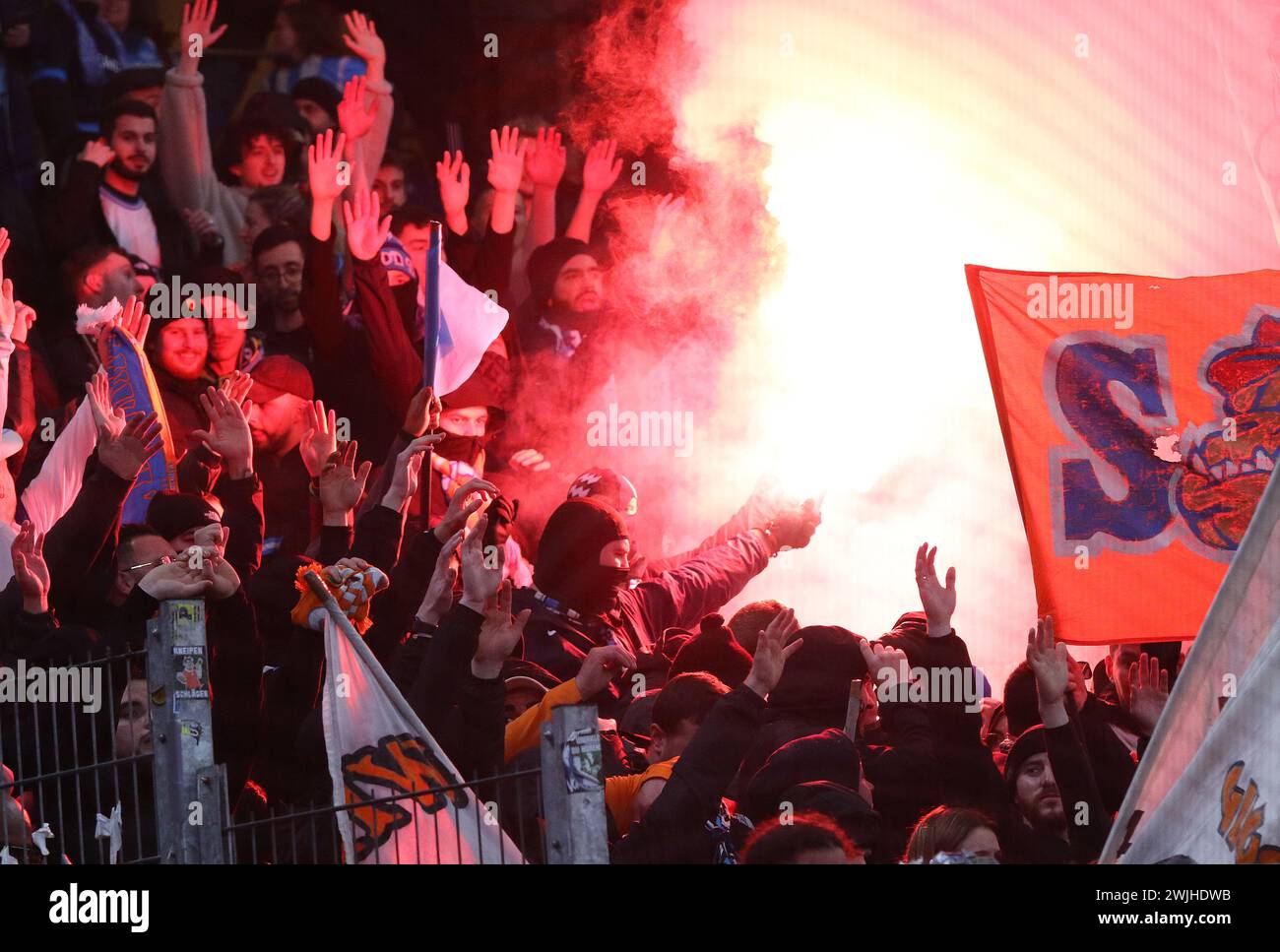 Hamburg, Germany - February 15, 2024: Marseille supporters burn flares and show their support during the UEFA Europa League game against Shakhtar Donetsk at Volksparkstadion in Hamburg, Germany Stock Photo