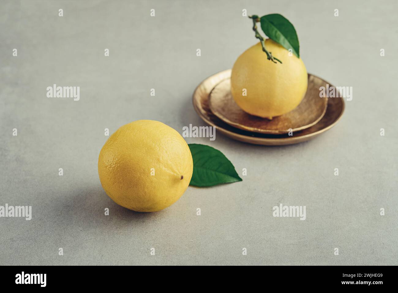 Fresh ripe bergamot orange fruits, fragrant citrus used in earl grey tea, medicine and spa treatments, on light background Stock Photo