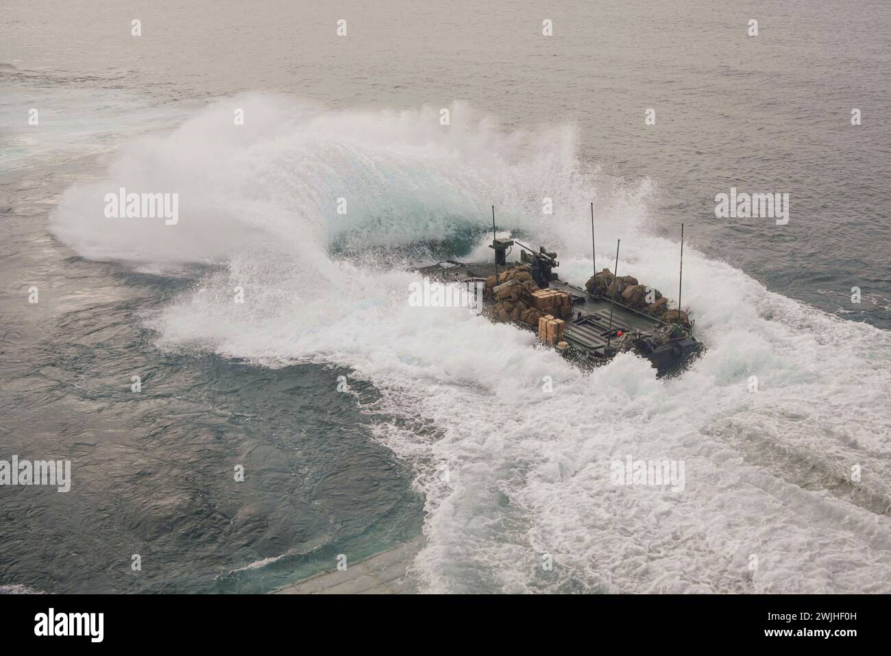 Pacific Ocean. 17th Jan, 2024. A U.S. Marine Corps amphibious combat vehicle (ACV), assigned to Battalion Landing Team (BLT) 1/5, 15th Marine Expeditionary Unit (MEU), launches from the well deck of the amphibious dock landing ship USS Harpers Ferry (LSD 4), while underway in the Pacific Ocean, January. 17, 2024. The Boxer Amphibious Ready Group, comprised of USS Boxer (LHD 4), USS Somerset (LPD 25), and Harpers Ferry, and the embarked 15th MEU are underway conducting integrated training and routine operations in U.S. 3rd Fleet. (Credit Image: © U.S. Navy/ZUMA Press Wire) EDITORIAL USAGE O Stock Photo