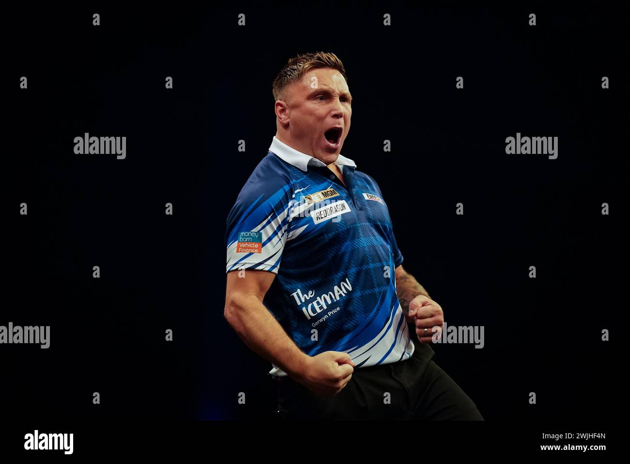 Gerwyn Price reacts after beating Luke Littler (not pictured)during