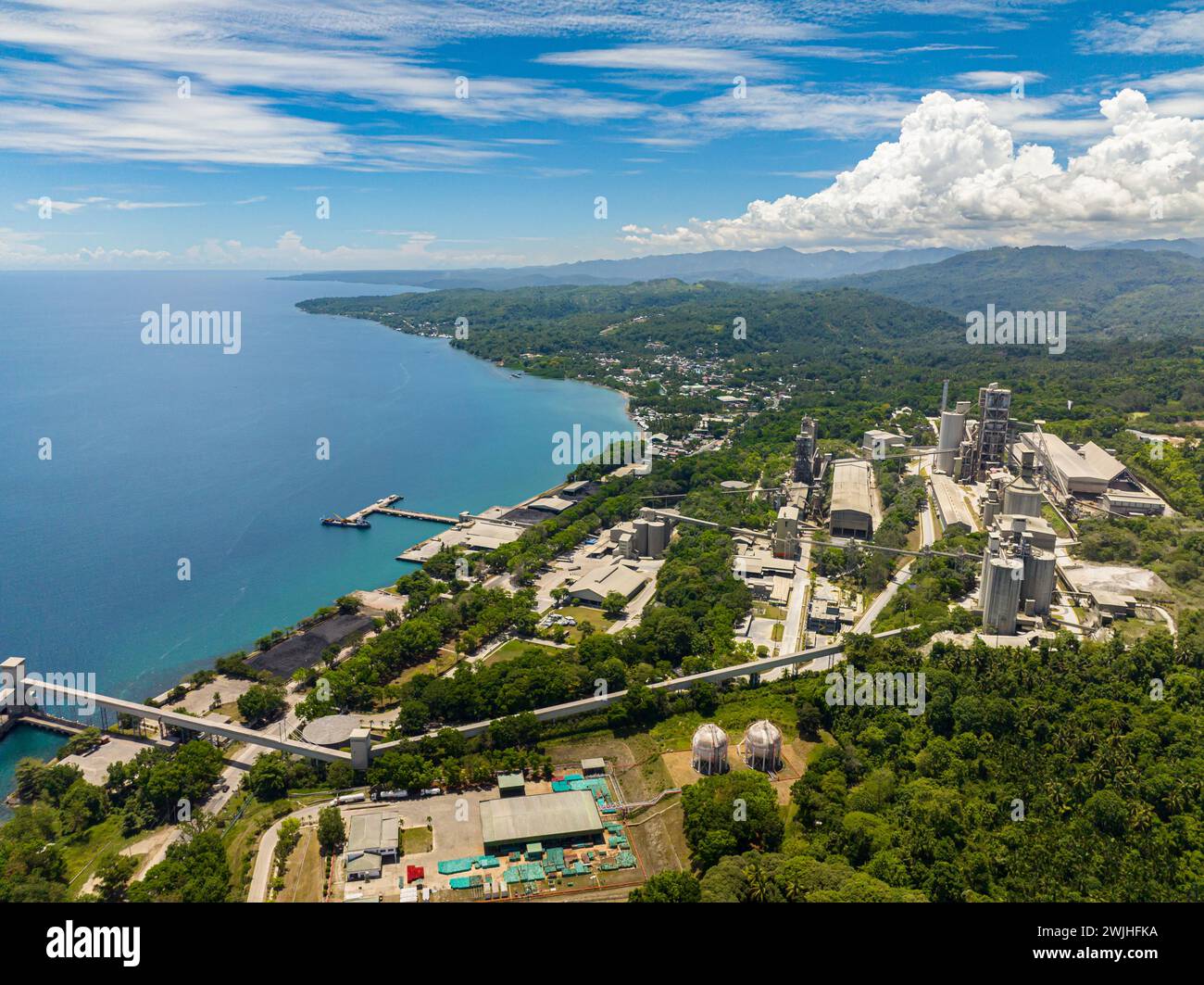 Seafront with Cement factory in Lugait, Misamis Oriental. Mindanao, Philippines. Stock Photo