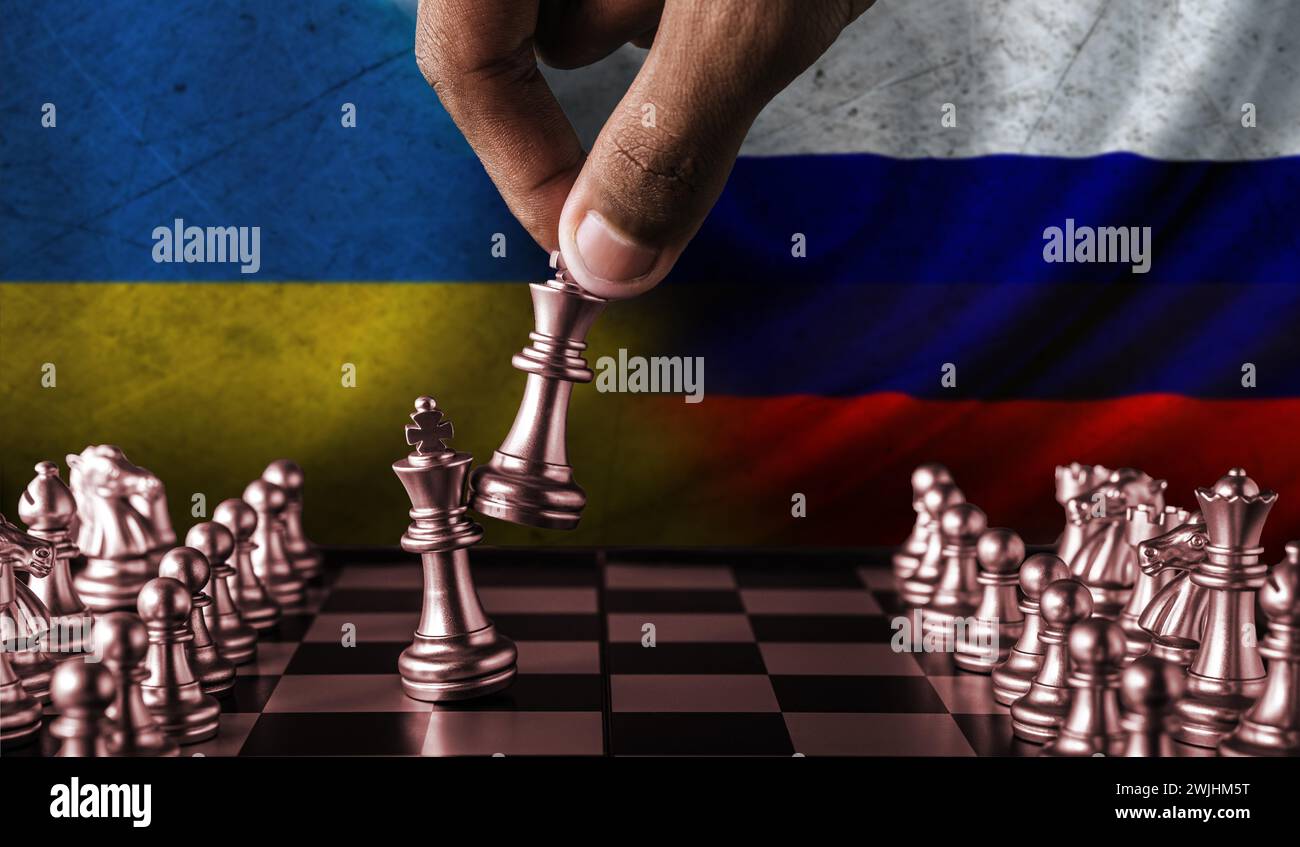 Russia vs Ukraine flag concept on chessboard. Political tension between Russia and Ukraine. Conflict between Russia and Ukraine over chess pieces Stock Photo