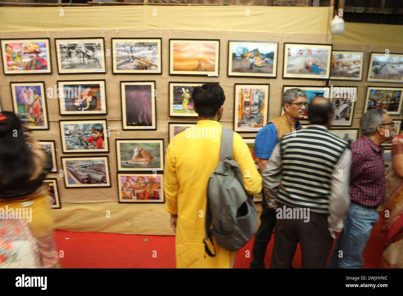Kolkata, India. 14th Feb, 2024. Visitors attend the opening ceremony of the Kolkata Press Photographers' Association first time open air street side footpath two day's Photo Exhibition, 120 Photojournalist participate and 240 photographs display in Kolkata. (Photo by Dipa Chakraborty/Pacific Press) Credit: Pacific Press Media Production Corp./Alamy Live News Stock Photo
