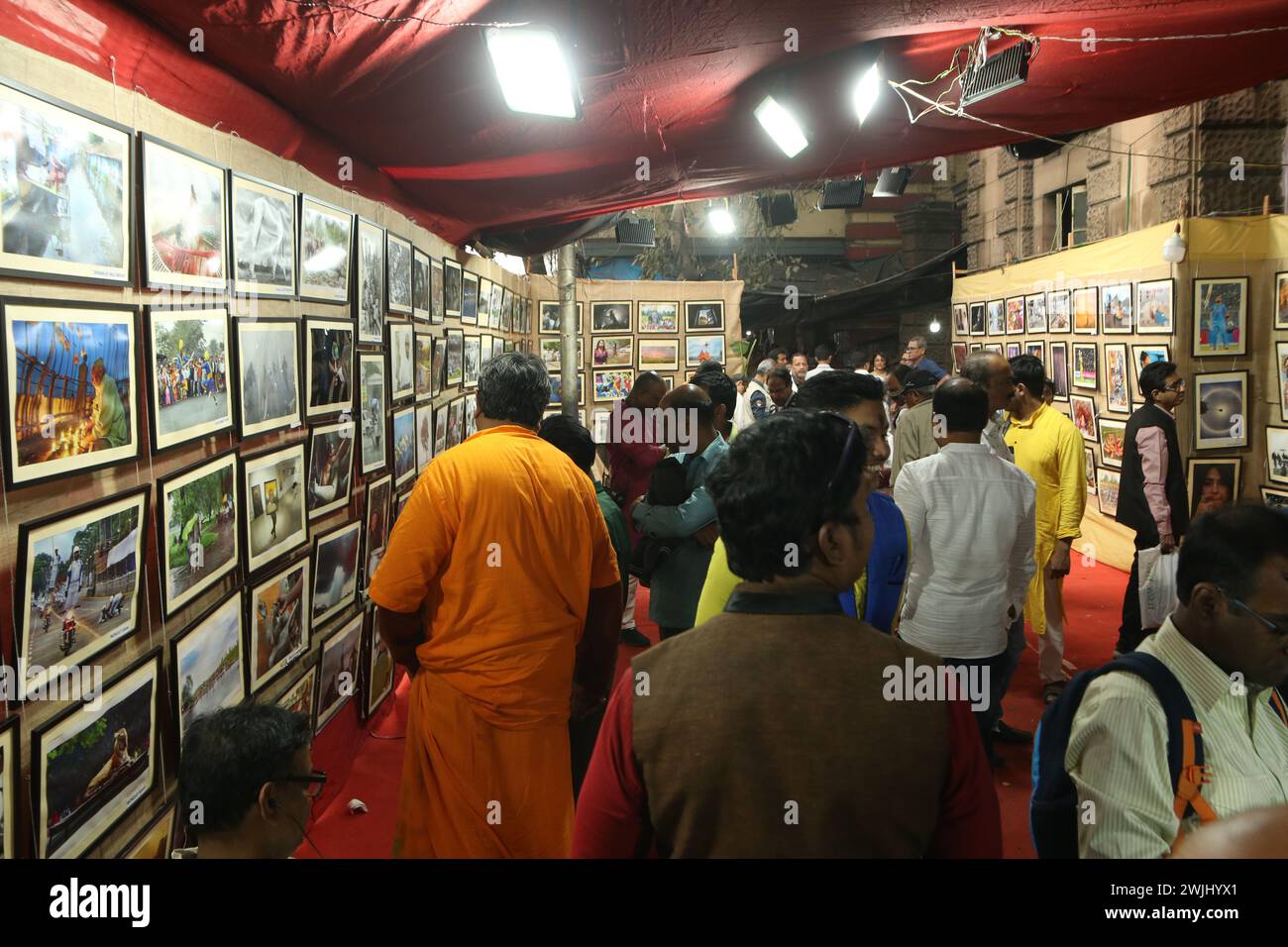 Kolkata, India. 14th Feb, 2024. Visitors attend the opening ceremony of the Kolkata Press Photographers' Association first time open air street side footpath two day's Photo Exhibition, 120 Photojournalist participate and 240 photographs display in Kolkata. (Photo by Dipa Chakraborty/Pacific Press) Credit: Pacific Press Media Production Corp./Alamy Live News Stock Photo