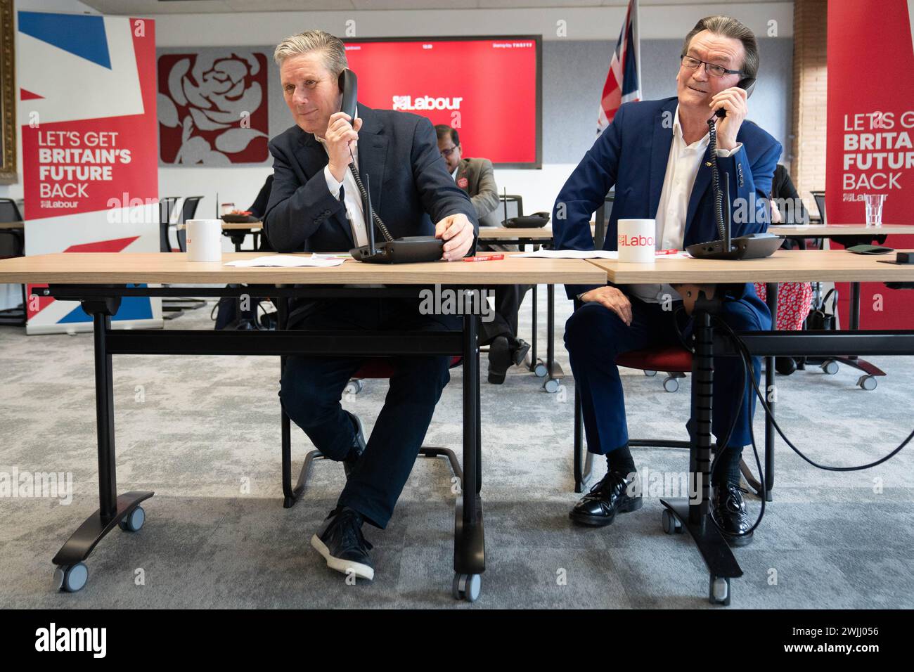 Labour leader Sir Keir Starmer (left) is joined by musician Feargal Sharkey canvassing voters by phone for the Wellingborough and Kingswood by-elections, at Labour HQ in London. Picture date: Thursday February 15, 2024. Stock Photo