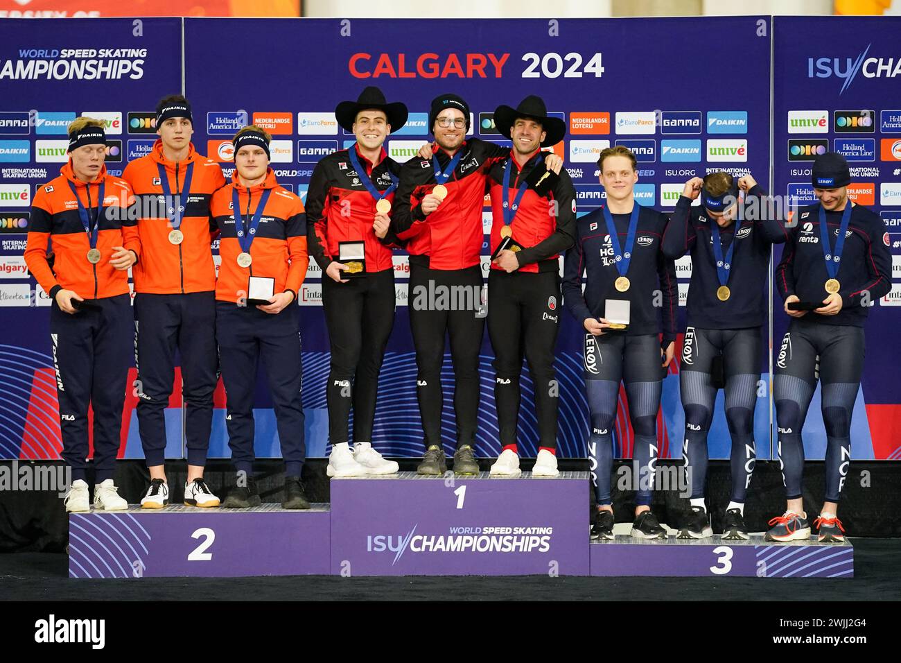 CALGARY, CANADA - FEBRUARY 16: Jenning de Boo of the Netherlands, Tim Prins of the Netherlands and Janno Botman of the Netherlands, Anders Johnson of Canada, Laurent Dubreuil of Canada and Antoine Gelinas Beaulieu of Canada, Henrik Fagerli Rukke of Norway, Bjorn Magnussen of Norway and Havard Holmefjord Lorentzen of Norway during the podium ceremony after competing on the Men's Team Sprint during the ISU World Speed Skating Single Distances Championships at Olympic Oval on February 16, 2024 in Calgary, Canada. (Photo by Andre Weening/Orange Pictures) Stock Photo