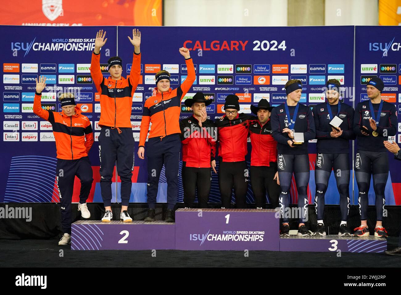 CALGARY, CANADA - FEBRUARY 16: Jenning de Boo of the Netherlands, Tim Prins of the Netherlands and Janno Botman of the Netherlands, Anders Johnson of Canada, Laurent Dubreuil of Canada and Antoine Gelinas Beaulieu of Canada, Henrik Fagerli Rukke of Norway, Bjorn Magnussen of Norway and Havard Holmefjord Lorentzen of Norway during the podium ceremony after competing on the Men's Team Sprint during the ISU World Speed Skating Single Distances Championships at Olympic Oval on February 16, 2024 in Calgary, Canada. (Photo by Andre Weening/Orange Pictures) Stock Photo