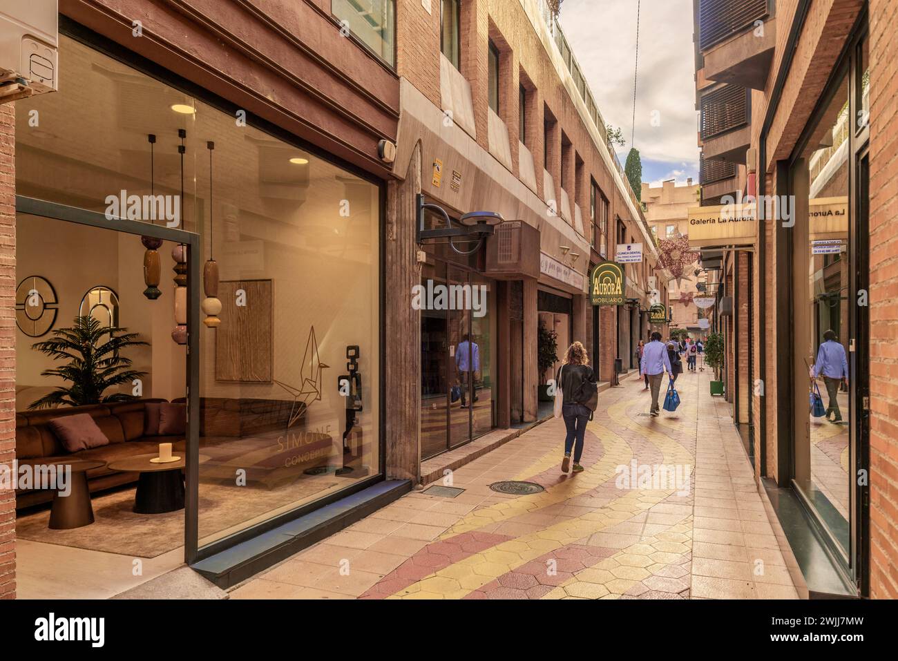 Aurora street, pedestrian commerce with shop windows of furniture and clothing stores in the city of Murcia region, Spain, Europe Stock Photo