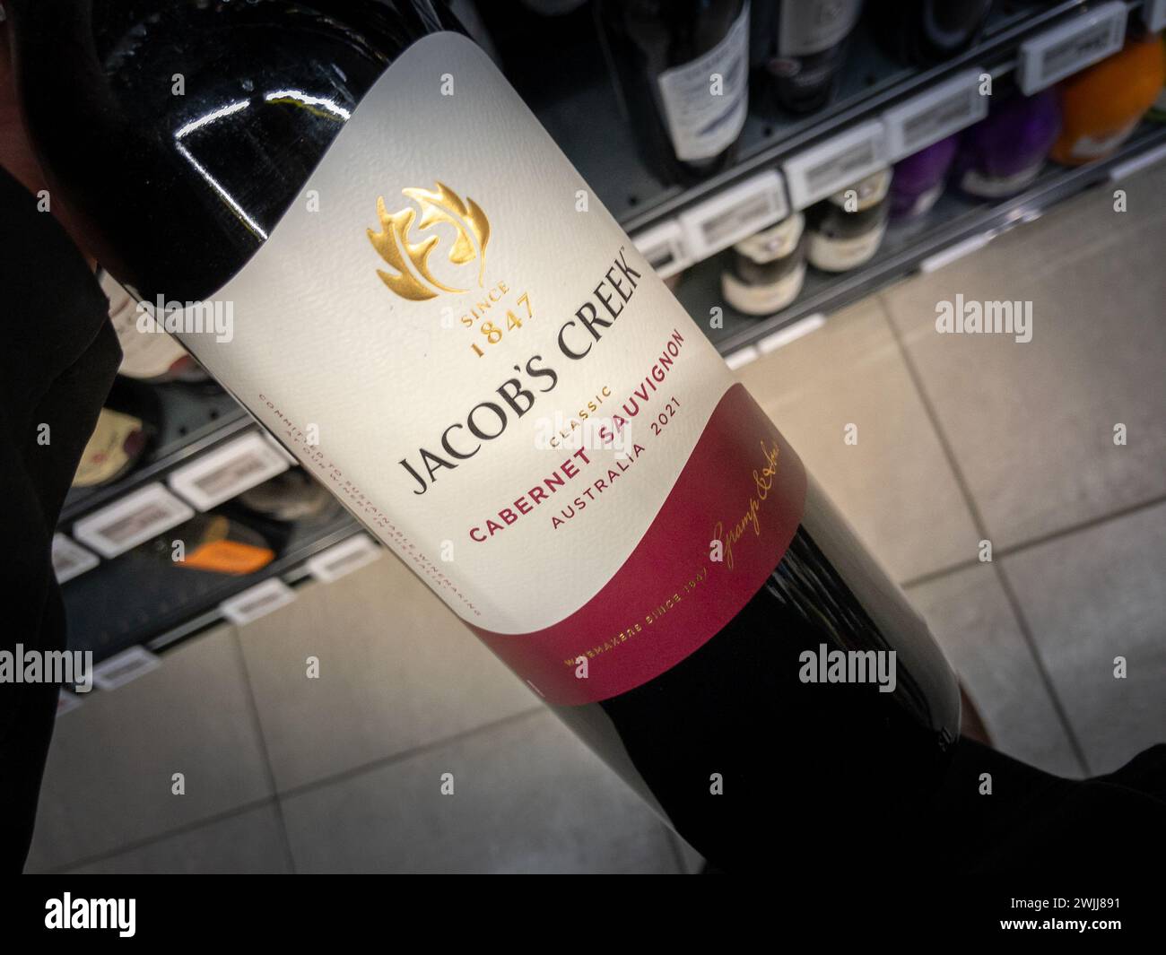 Picture of a sign with the logo of Jacob's CReek in Belgrade, serbia, on a bottle of red wine. Jacob's Creek is an Australian wine label with a storie Stock Photo