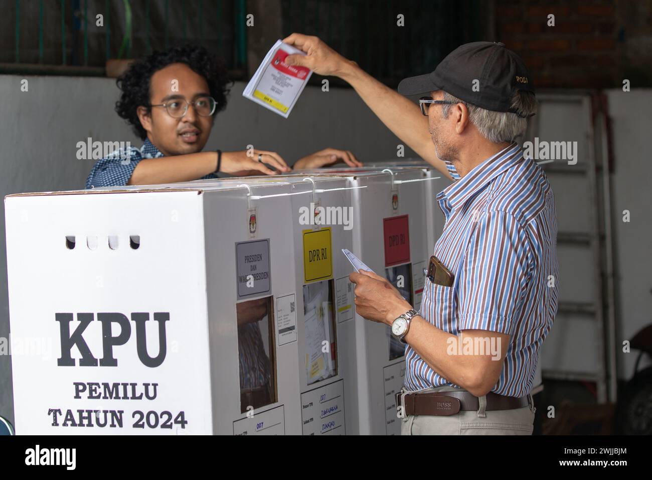 Bandung, Indonesia - February 14, 2024: People seen participating in General Election in Indonesia. Stock Photo