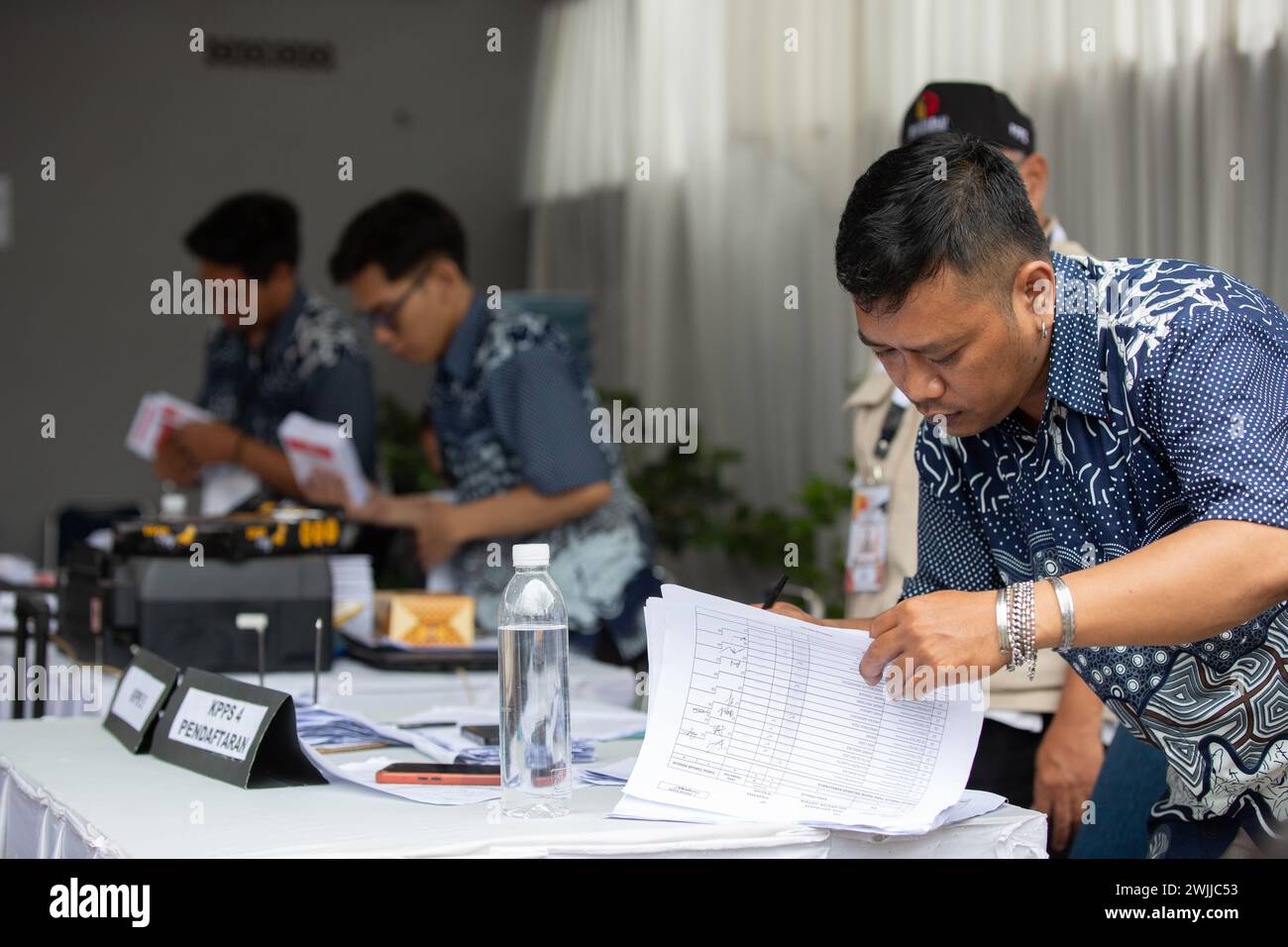 Bandung, Indonesia - February 14, 2024: People seen participating in General Election in Indonesia. Stock Photo