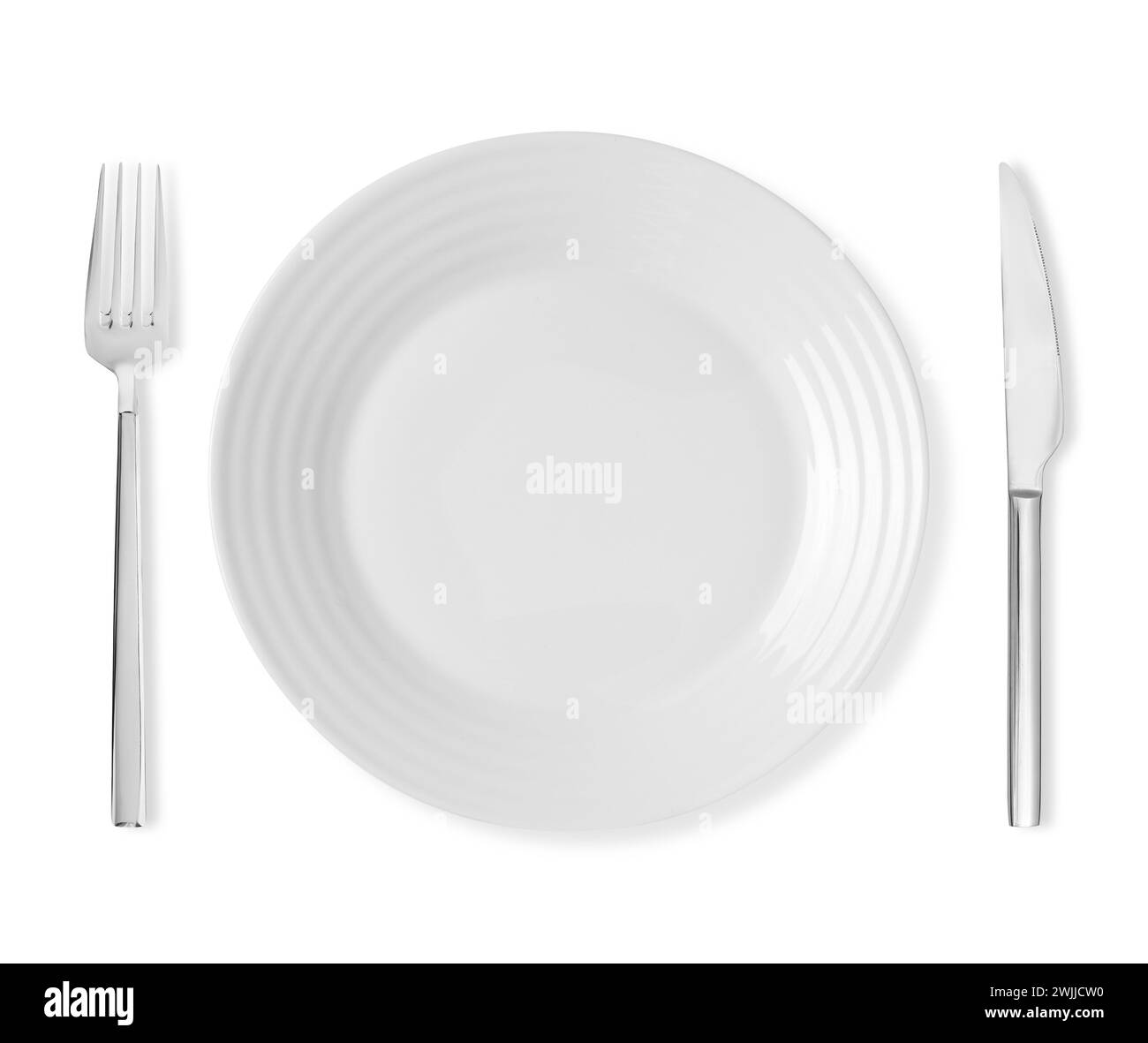 Clean plate, fork and knife on white background, top view Stock Photo ...