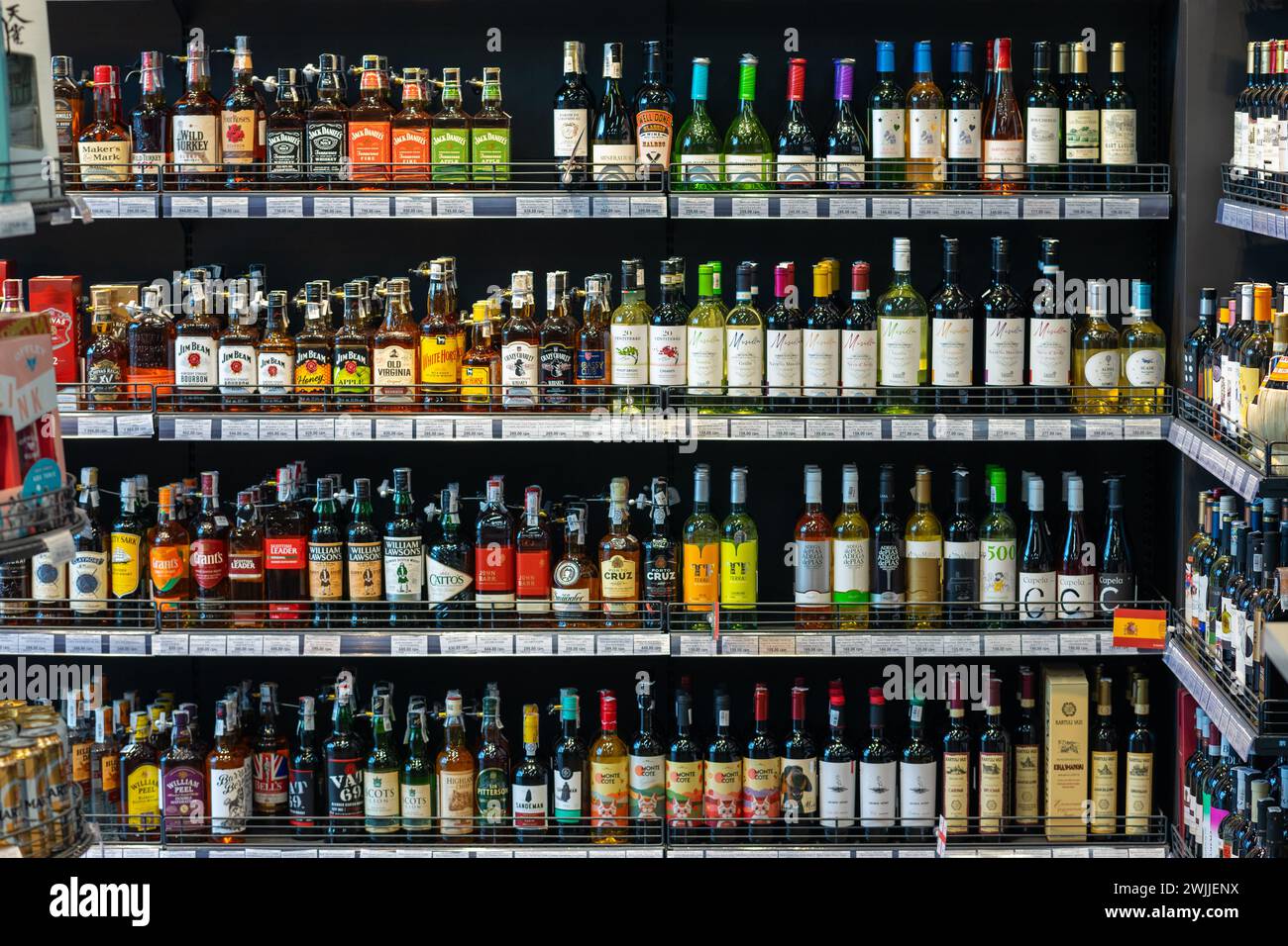 Shop window with alcoholic drinks. Many alcoholic beverages on the shelves in the store. 2023.07.20 Vinnytsia, Ukraine Stock Photo