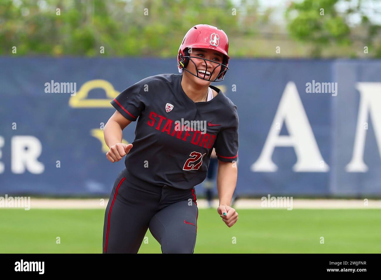 Stanford outfielder Kaitlyn Lim smiles after been batted in for a score ...