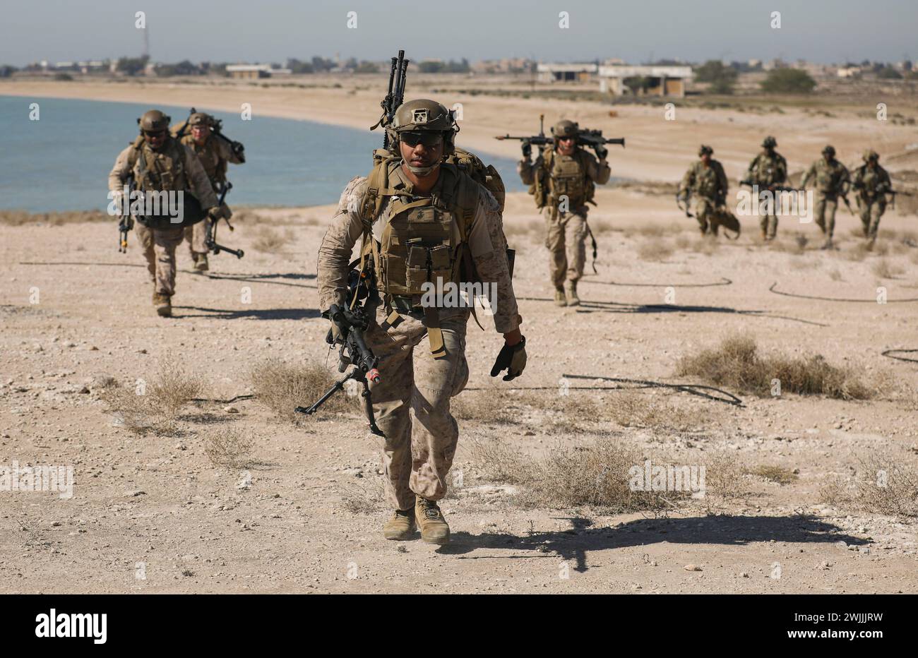 240206-M-IU565-1194 FAILAKA ISLAND, Kuwait (Feb. 6, 2024) Marines assigned to Fleet Anti-Terrorism Security Team Central Command conduct a patrol while participating in the final evolution of exercise Eager Defender 24 on Failaka Island, Kuwait, Feb. 6. Eager Defender 24 is the capstone in a series of bilateral exercises between Kuwait and U.S. naval forces, focused on enhancing mutual capabilities and interoperability in maritime security operations. (U.S. Marine Corps photo) Stock Photo