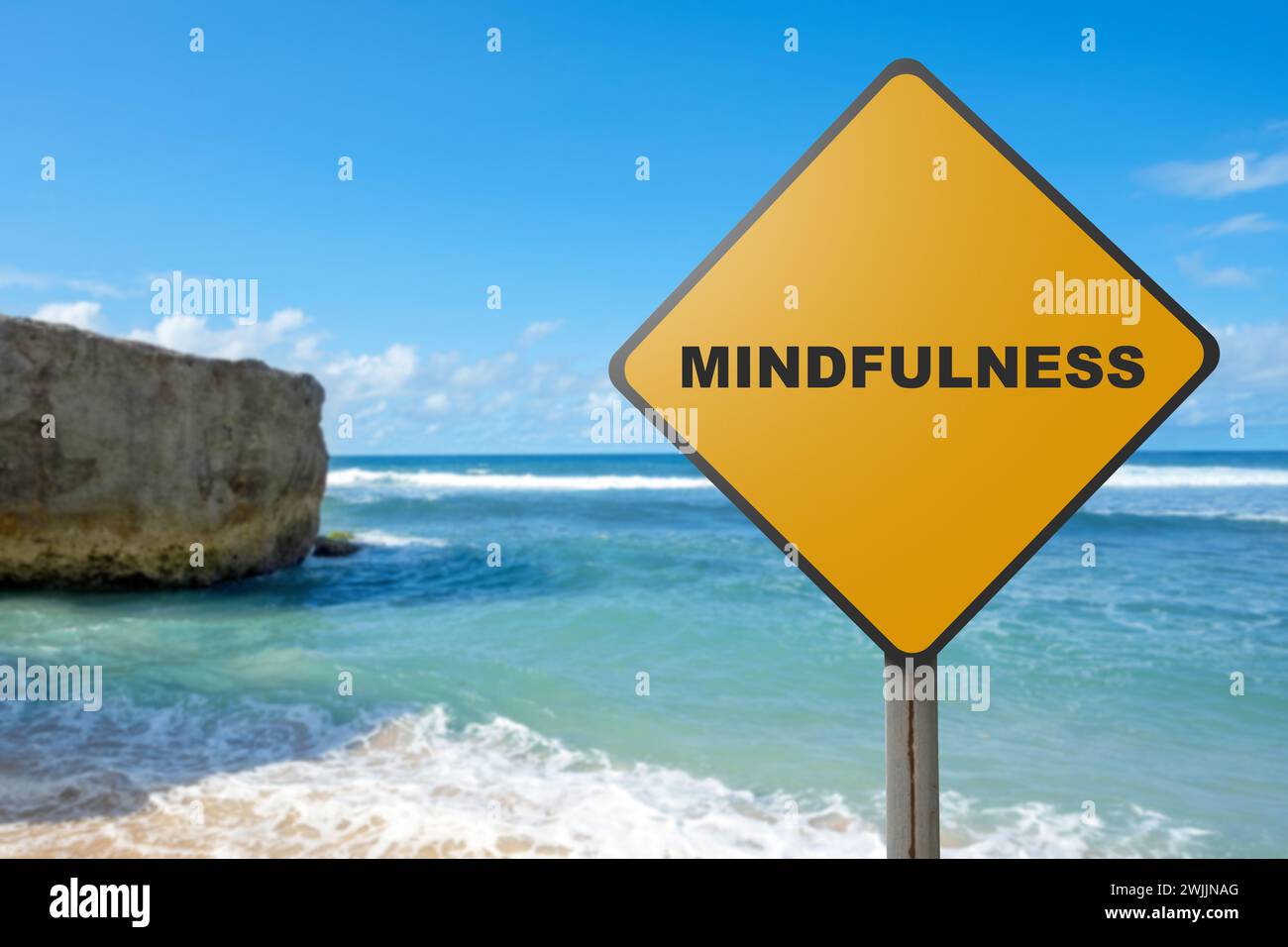 Road sign with mindfulness text and ocean view with blue sky. Health ...