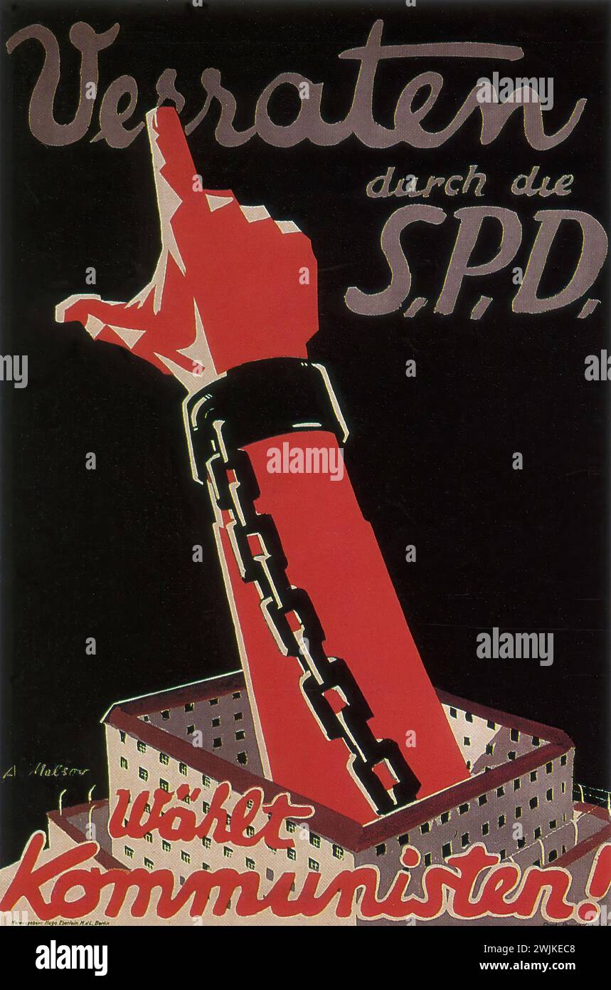'Verraten durch die SPD. Wählt Kommunisten!' ['Betrayed by the SPD. Vote Communists!'] Vintage German Advertising, 1930. A pointed finger breaks through a chain, with bold text above and below. The graphic style is stark and propagandistic, with a limited color palette emphasizing red, black, and white. Stock Photo