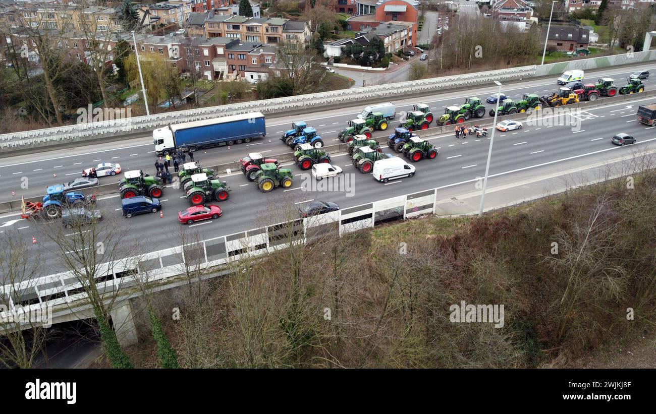 Alleur, Belgium. 16th Feb, 2024. Aerial drone picture shows a filtering blockade on the A3 - E40 highway, in Alleur, Friday 16 February 2024. Farmers in the Walloon region continue their protests to demand better conditions to continue farming. BELGA PHOTO STRINGER Credit: Belga News Agency/Alamy Live News Stock Photo