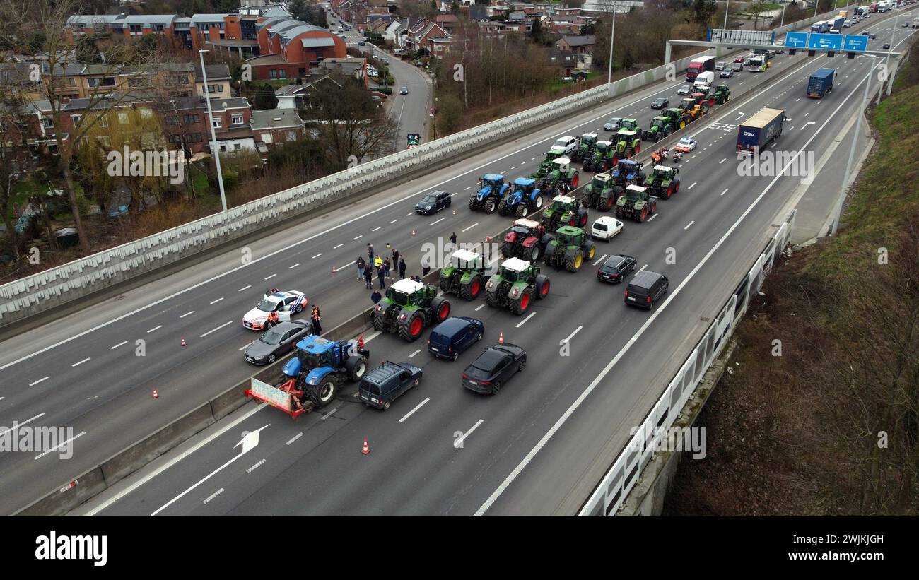 Alleur, Belgium. 16th Feb, 2024. Aerial drone picture shows a filtering blockade on the A3 - E40 highway, in Alleur, Friday 16 February 2024. Farmers in the Walloon region continue their protests to demand better conditions to continue farming. BELGA PHOTO STRINGER Credit: Belga News Agency/Alamy Live News Stock Photo