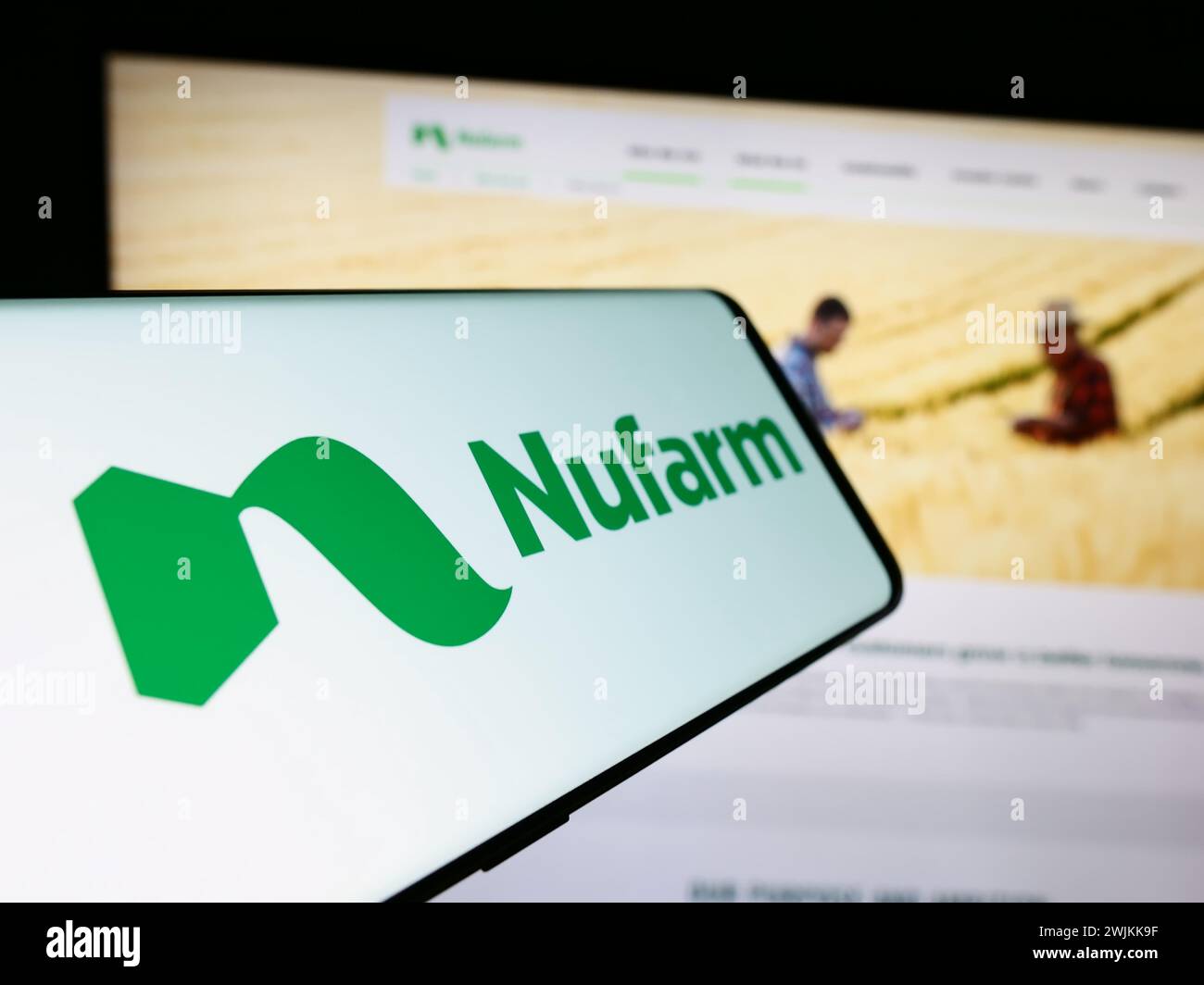 Smartphone with logo of Australian agrochemical company Nufarm Limited in front of business website. Focus on center-left of phone display. Stock Photo