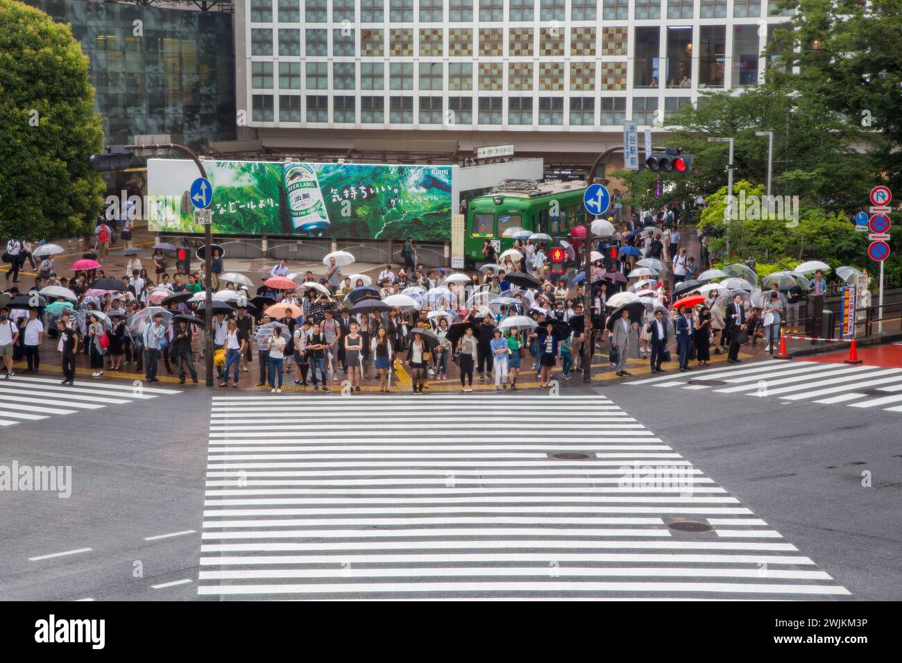 Tokyo, Japan - 21 June 2016: A rainy day in Tokyo, and many people with ...