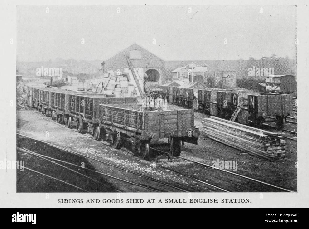 SIDINGS AND GOODS SHED AT A SMALL ENGLISH STATION. from the Article ENGLISH GOODS STATIONS AND RAILWAY YARDS. By Arch. R. Whitehead. from The Engineering Magazine Devoted to Industrial Progress Volume XIV October 1897 - March 1898 The Engineering Magazine Co Stock Photo