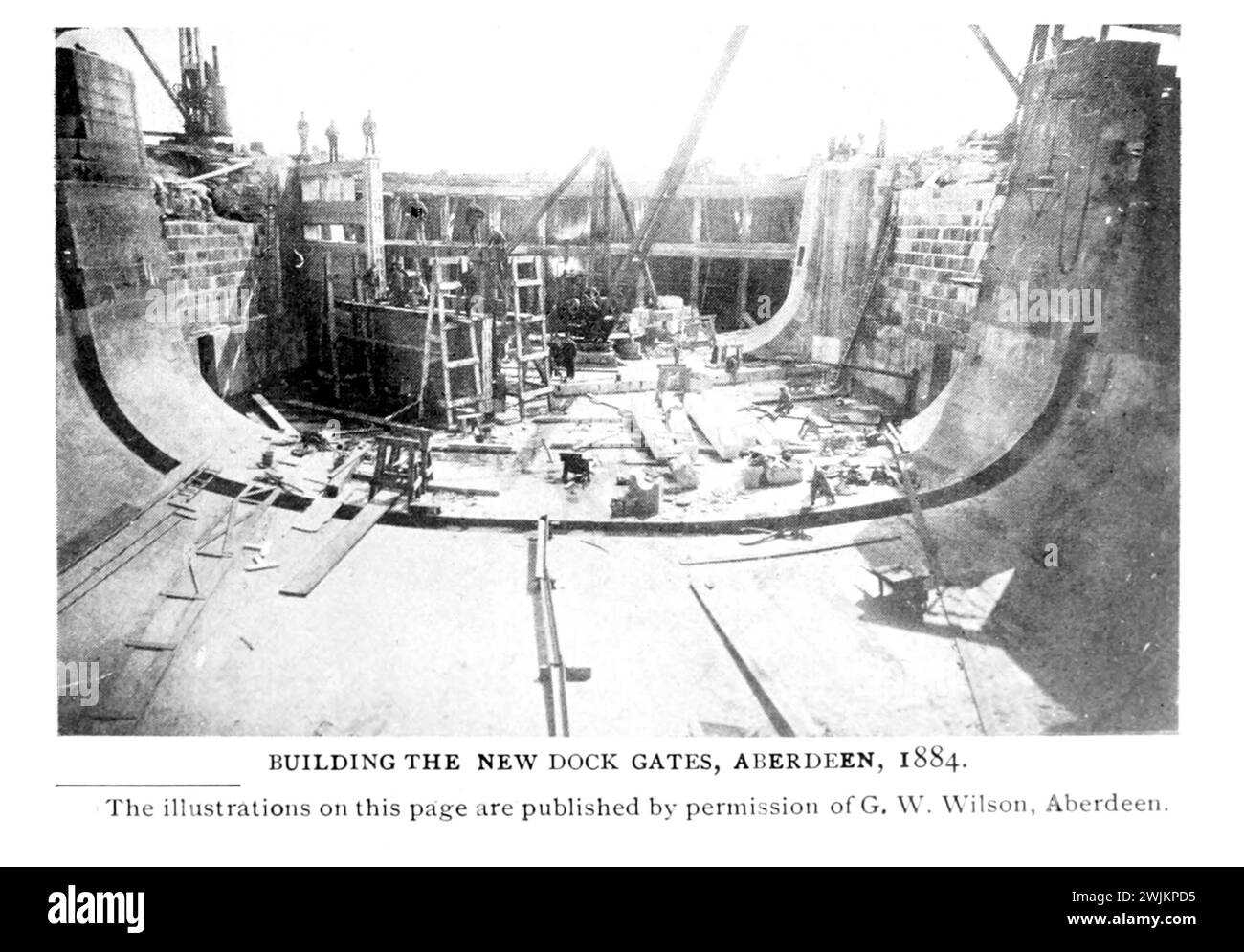 BUILDING THE NEW DOCK GATES, ABERDEEN, 1884. from the Article MODERN WHARF IMPROVEMENTS AND HARBOR FACILITIES. Part III By Foster Crowell. from The Engineering Magazine Devoted to Industrial Progress Volume XIV October 1897 - March 1898 The Engineering Magazine Co Stock Photo