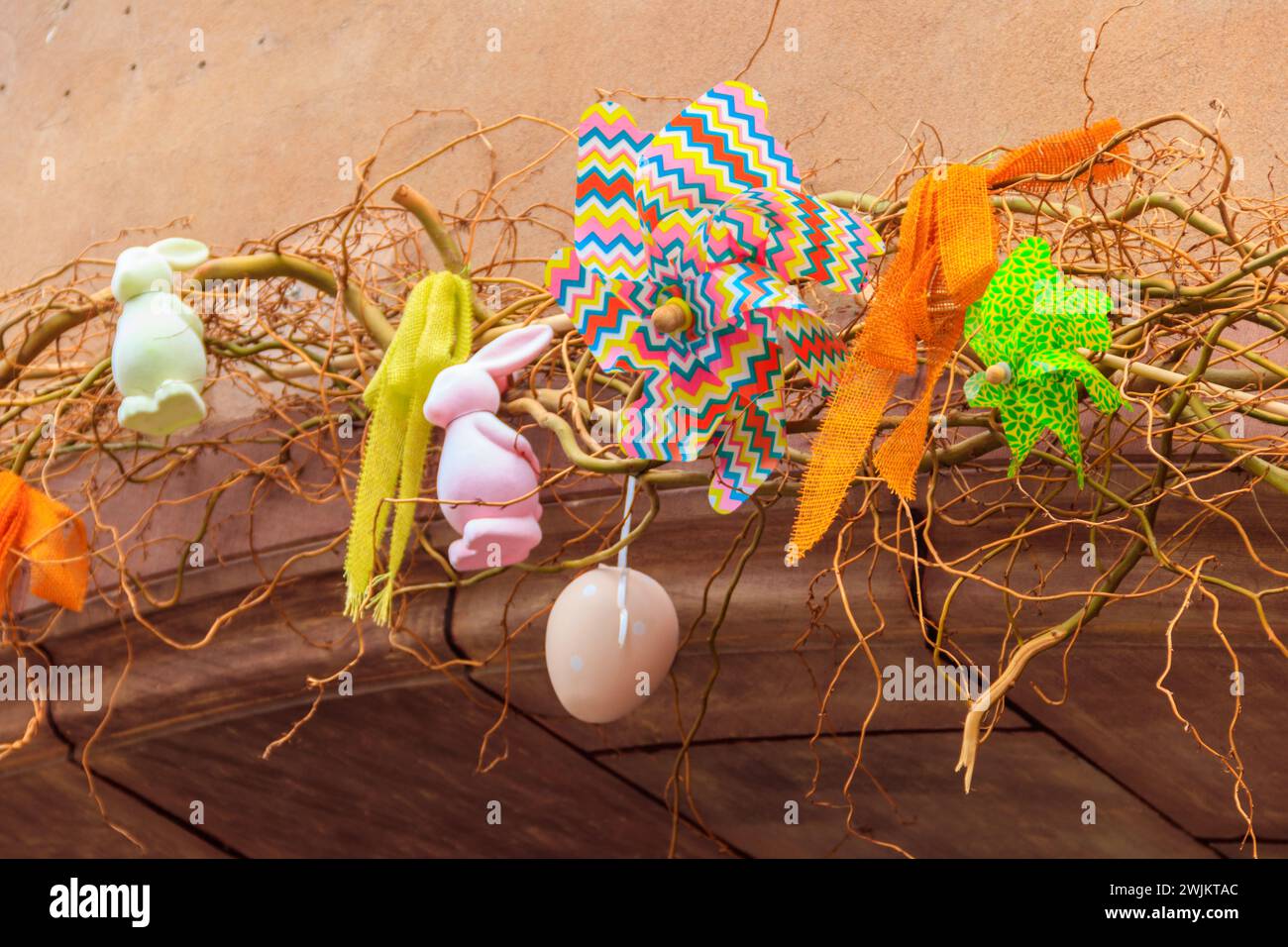 Easter decoration with Easter bunnies and Easter eggs on a house Stock Photo