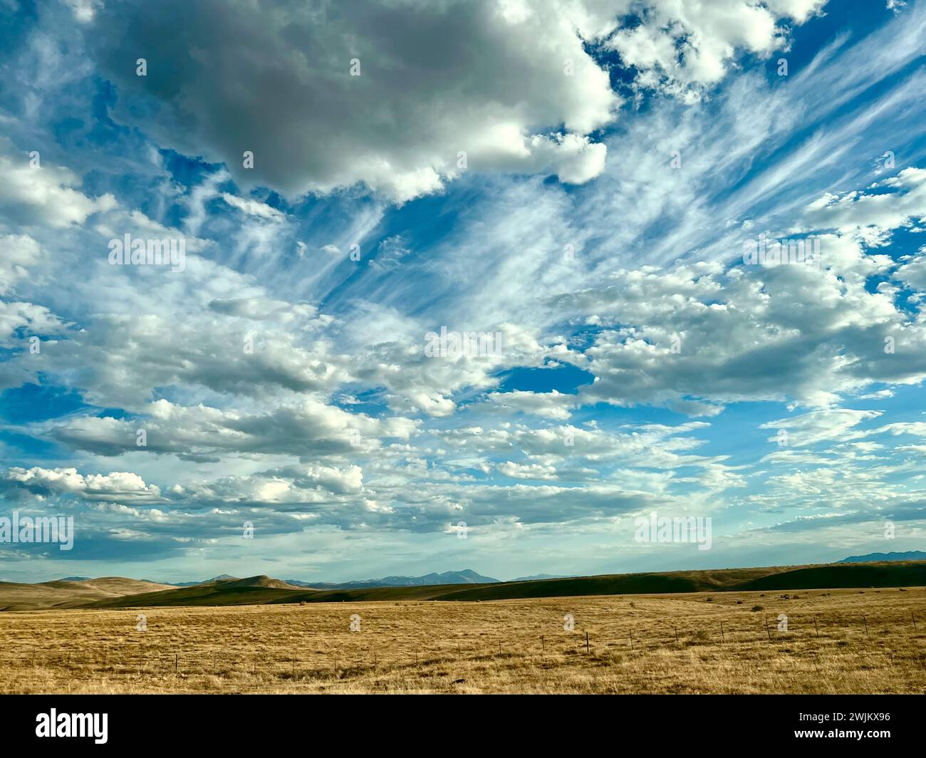 Crazy clouds in the skies above farmland Stock Photo