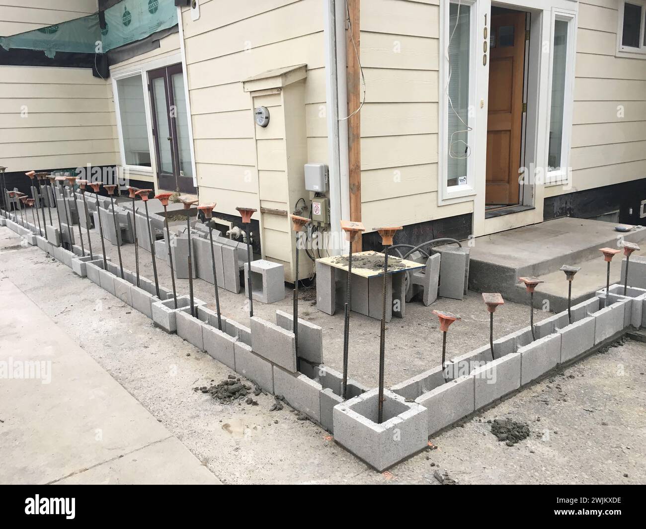 Construction on a wrap around porch for home Stock Photo