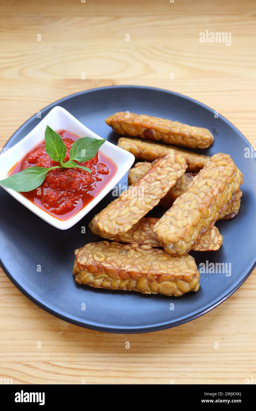 Pan fried Tempeh with homemade marinara sauce, a healthy and tasty dish