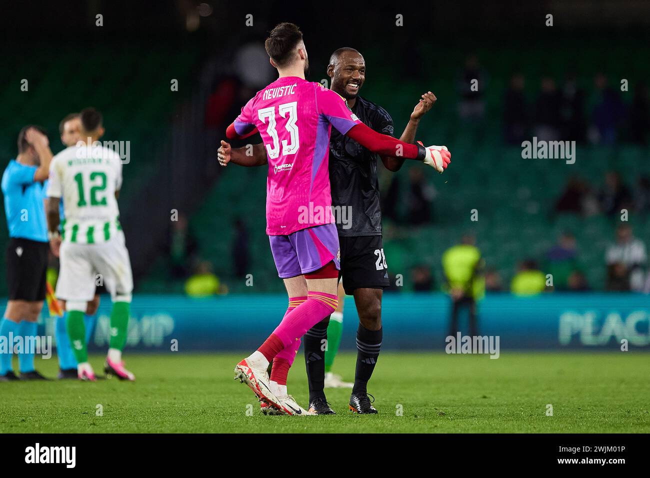 Seville, Spain. 15th Feb, 2024. Goalkeeper Ivan Nevistic (33) and Kevin Theophile-Catherine (28) of Dinamo Zagreb seen after the final whistle of the UEFA Conference League match between Real Betis and Dinamo Zagreb at the Estadio Benito Villamarin in Seville. (Photo Credit: Gonzales Photo/Alamy Live News Stock Photo