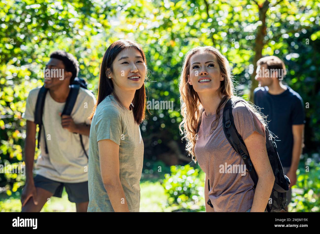Two women looking up during hiking excursion Stock Photo