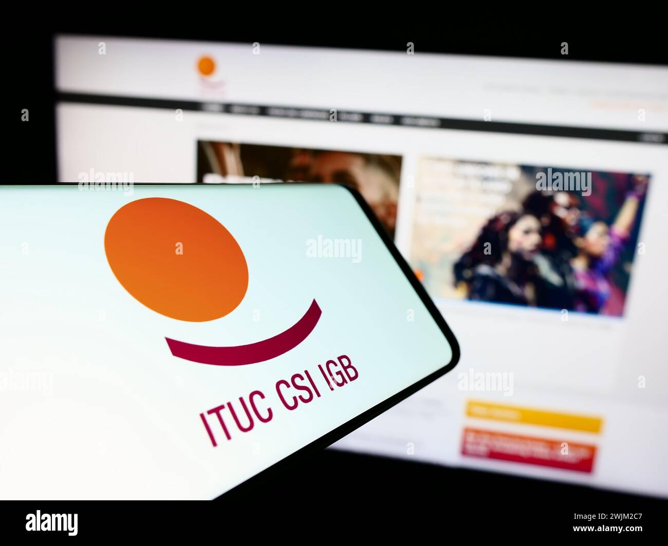Cellphone with logo of federation International Trade Union Confederation (ITUC) in front of website. Focus on center-right of phone display. Stock Photo
