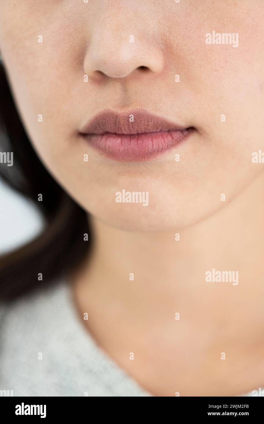 Framing of mouth of a young adult woman Stock Photo