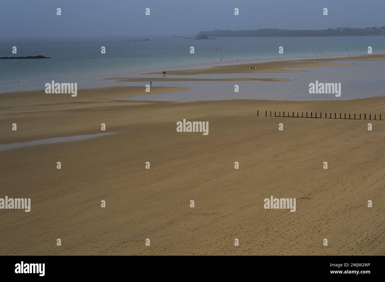 Empty beach on an overcast day in Normandie Stock Photo