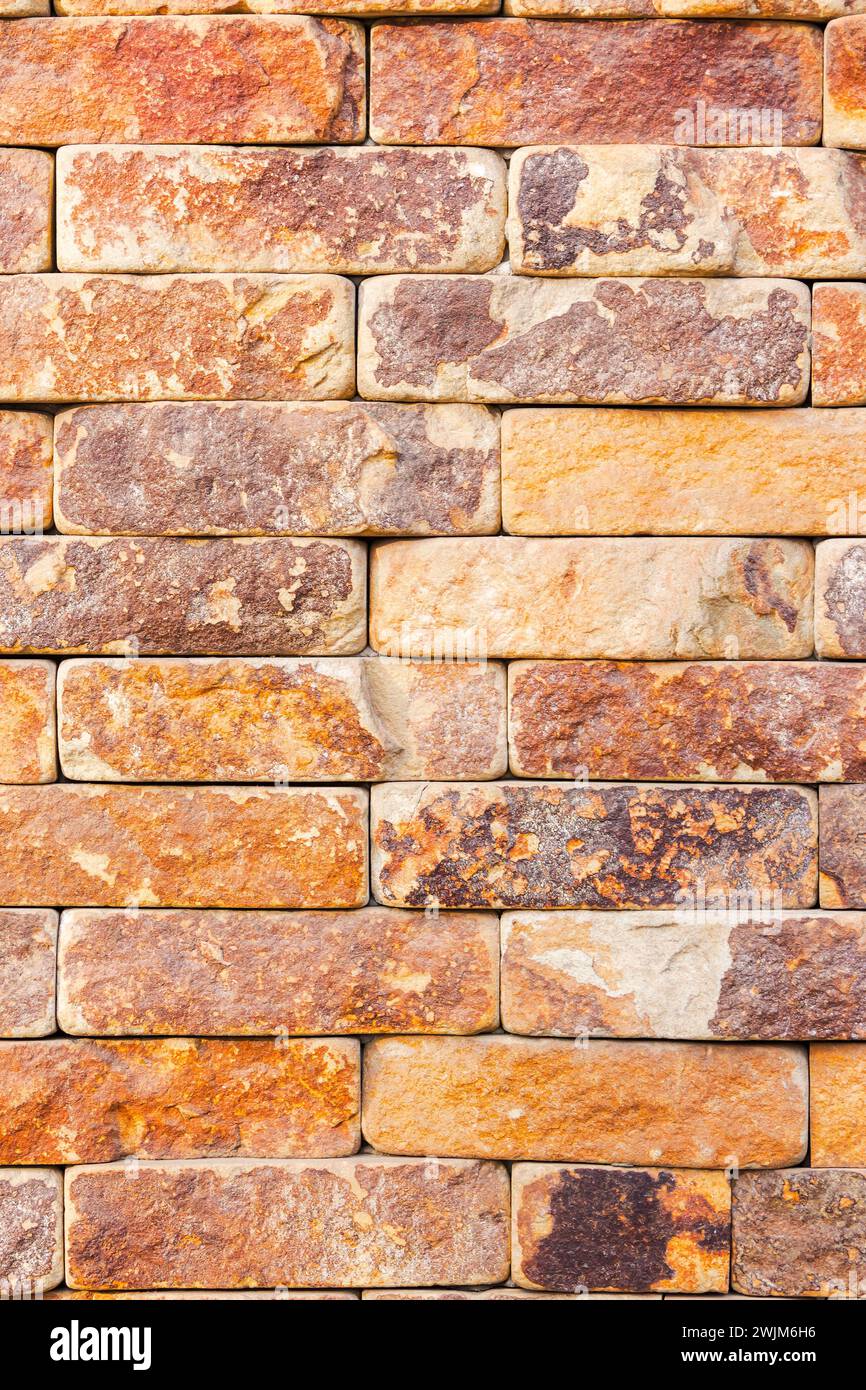 masonry of yellow brick tile. decorative architecture pattern for outdoor renovation Stock Photo