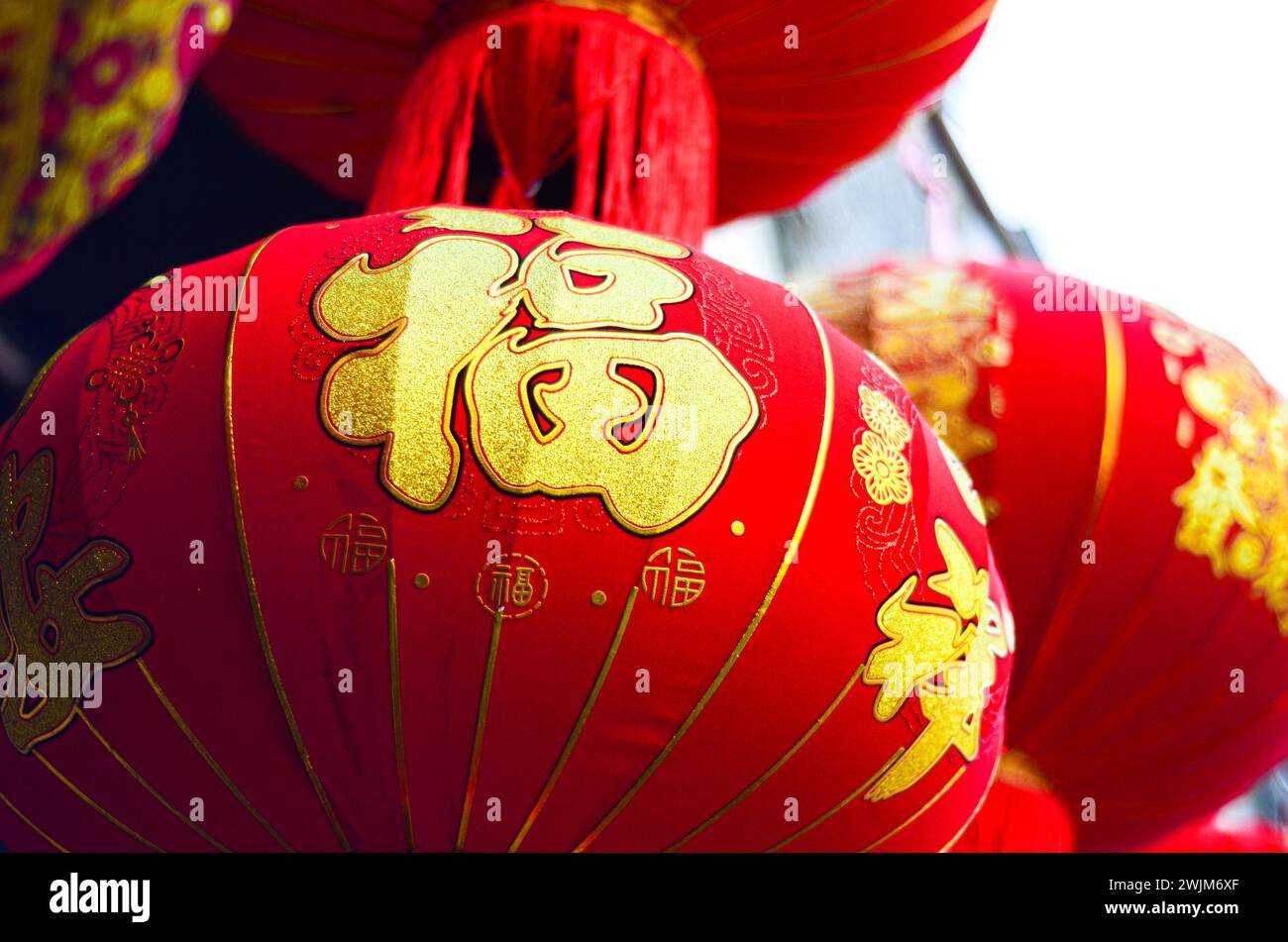 The traditional Chinese red lanterns hanging in front of people’s house ...
