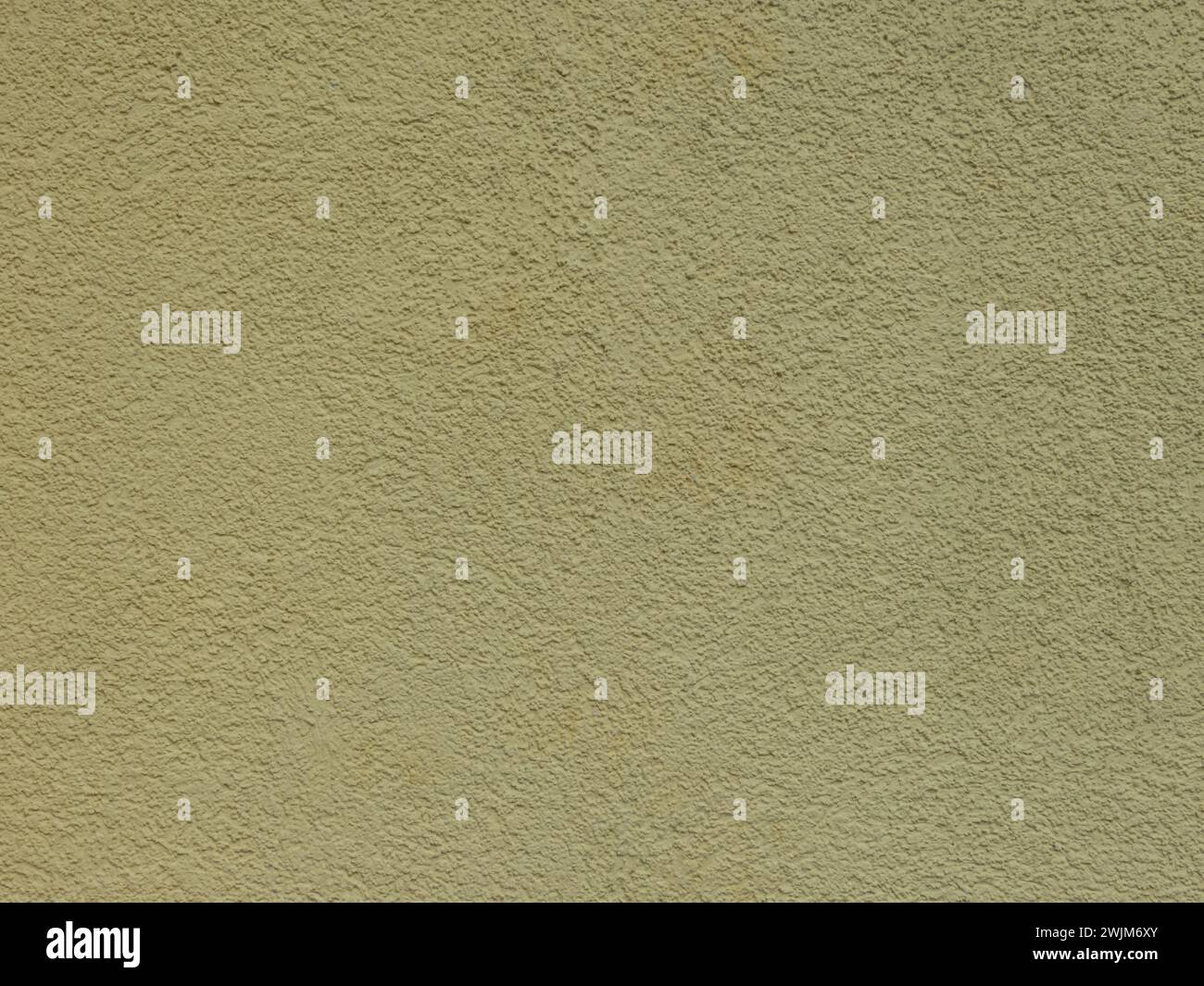 Textured plaster on a wall in the color yellow, texture background Stock Photo