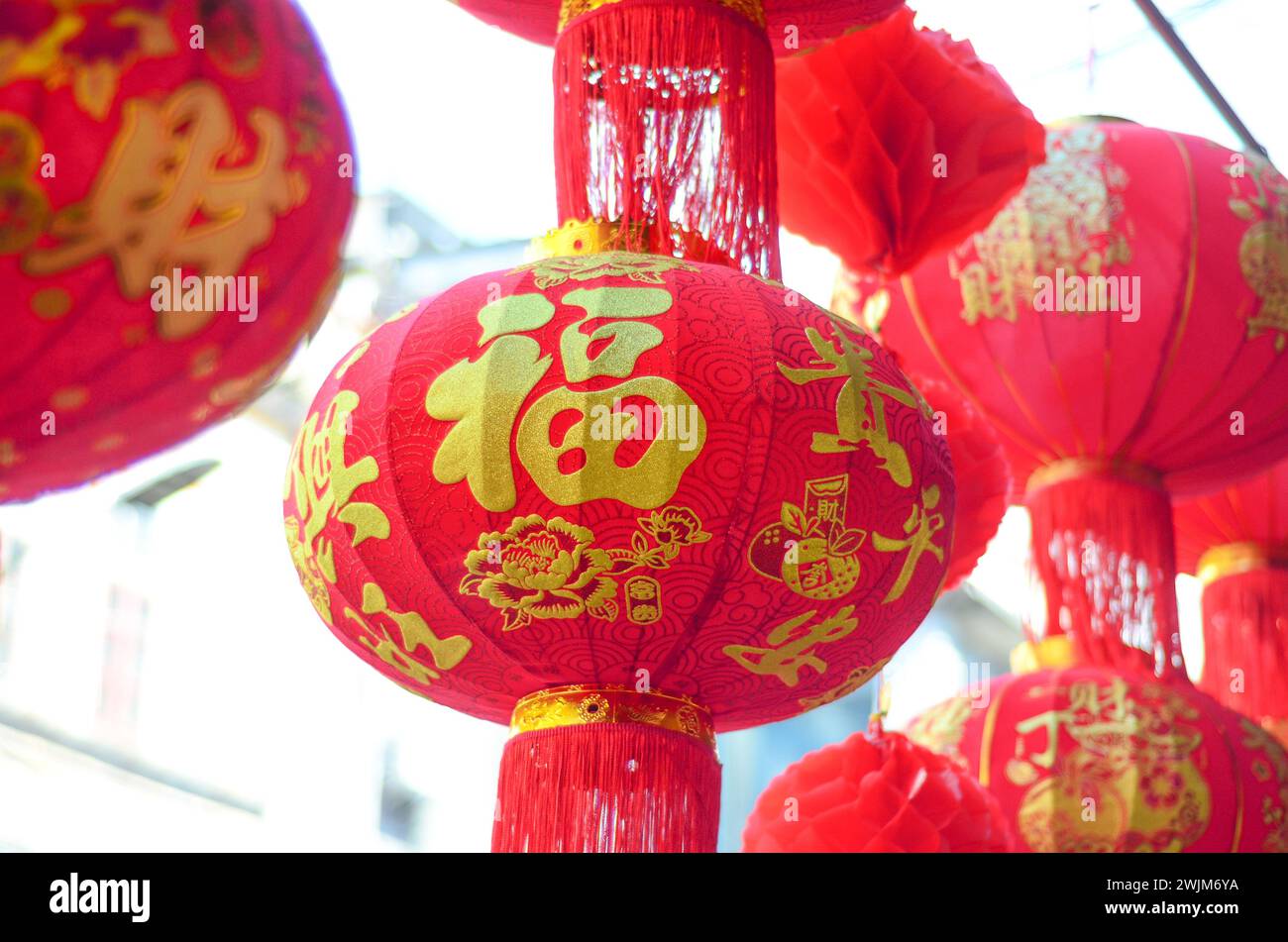 The traditional Chinese red lanterns hanging in front of people’s house ...
