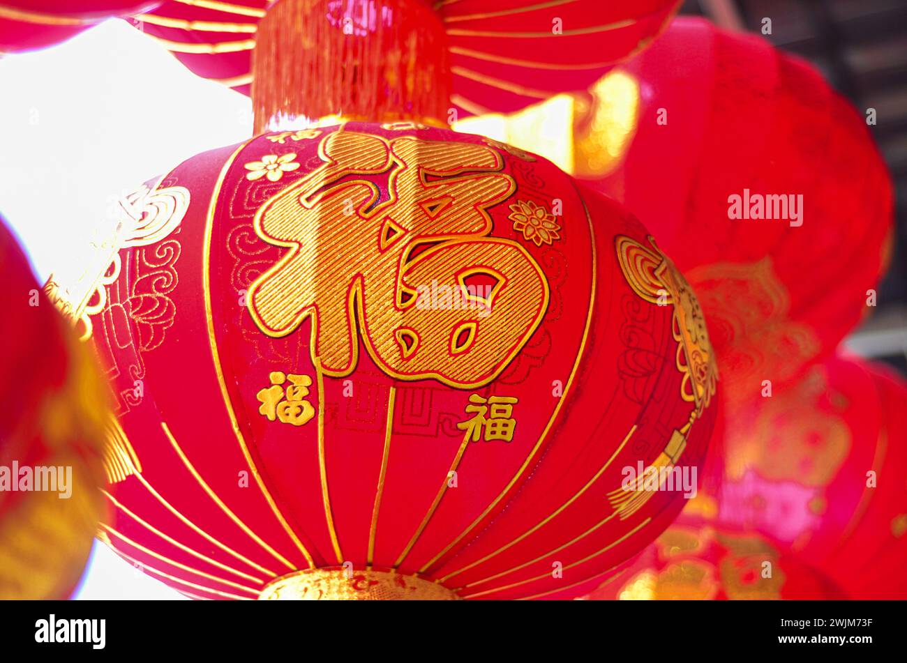The traditional Chinese red lanterns hanging in front of people’s house ...
