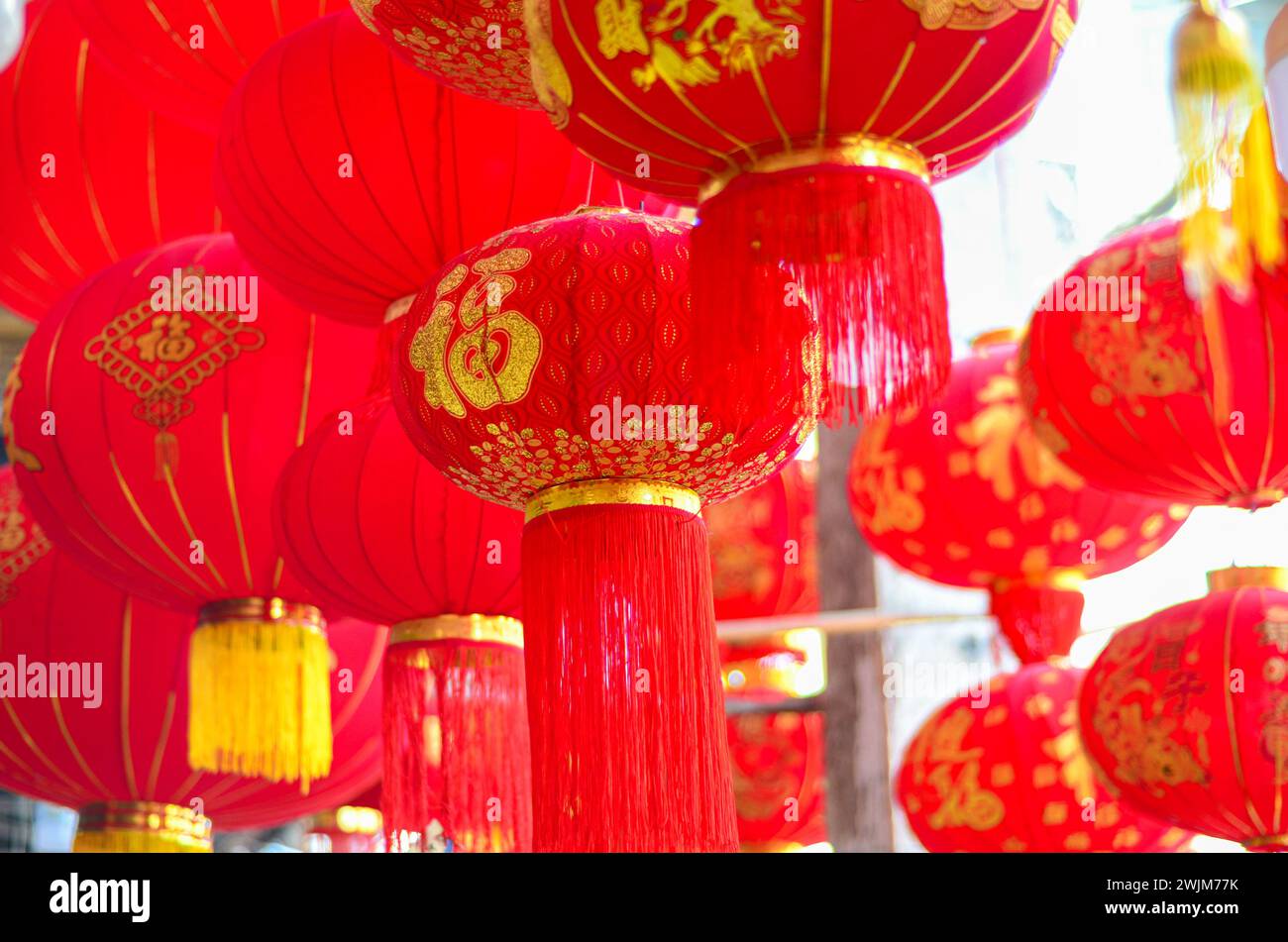 The traditional Chinese red lanterns hanging in front of people’s house ...